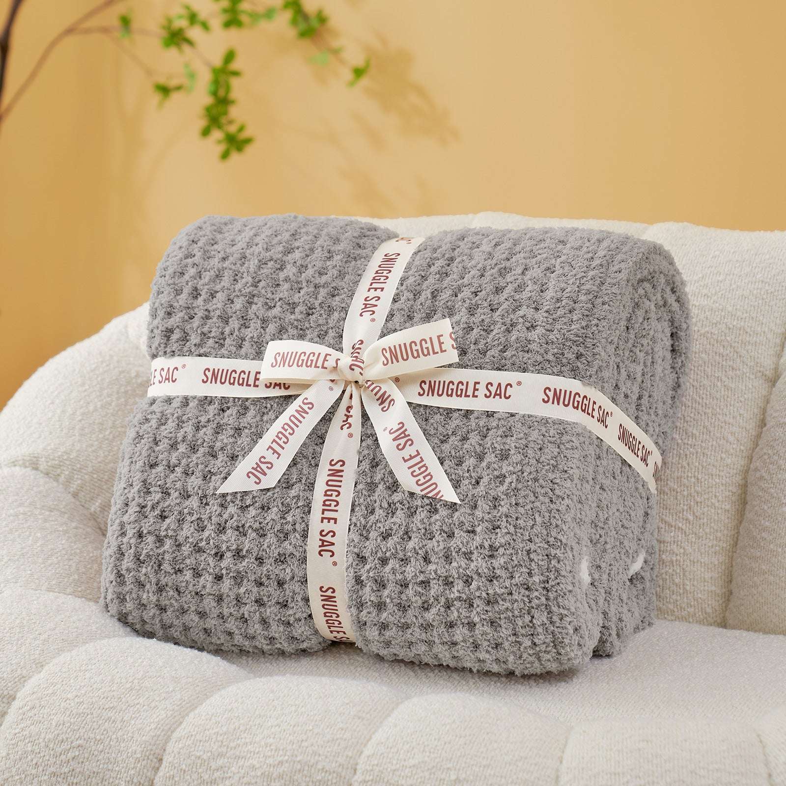 Soft Waffle Feather Yarn Knit Throw Blanket wrapped as a perfect gift with ribbon#Color_Grey