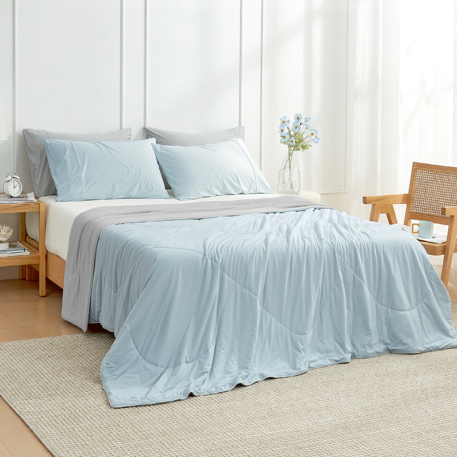 Bedroom view at 45 degrees, featuring a Snuggle Sac grey/blue cooling comforter on the bed for hot sleepers#color_Grey/Blue