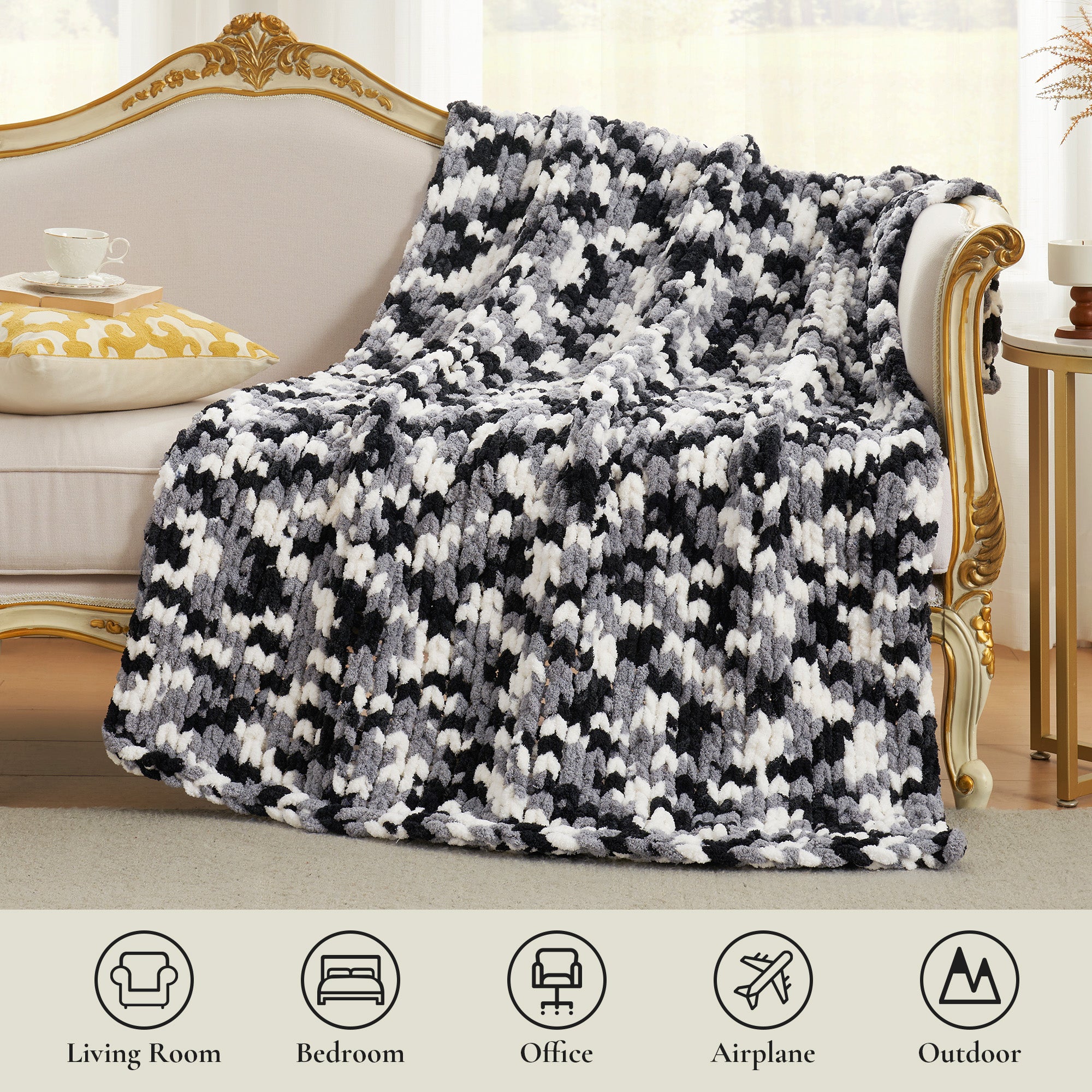 Chunky chenille knit throw blanket in Black draped over sofa suitable for living room bedroom office and travel use #color_Black
