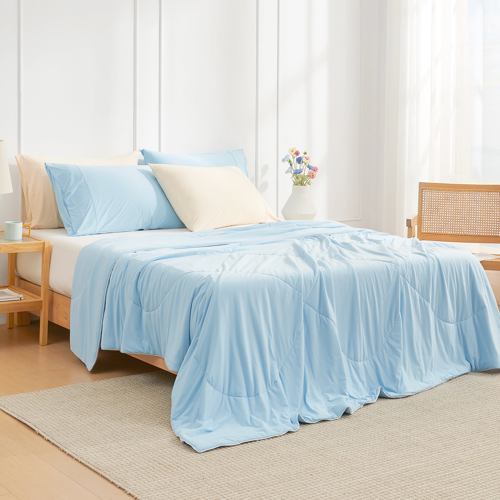 Bedroom view at 45 degrees, featuring a Snuggle Sac cooling comforter on the bed for hot sleepers #color_Sky Blue