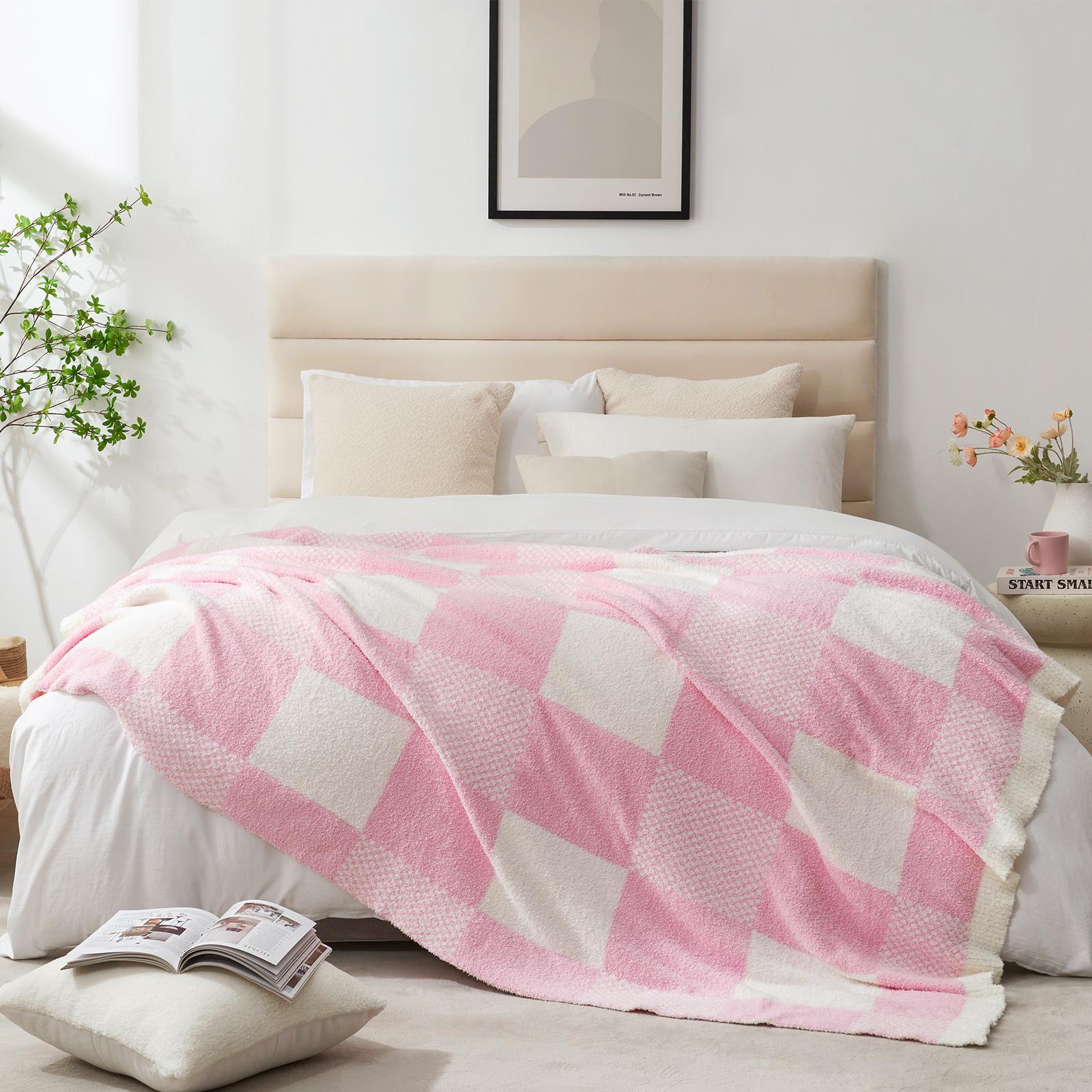 Snuggle Sac Checkered Feather Yarn Knit Throw Blanket on the bed with furnitures in the room#color_Pink