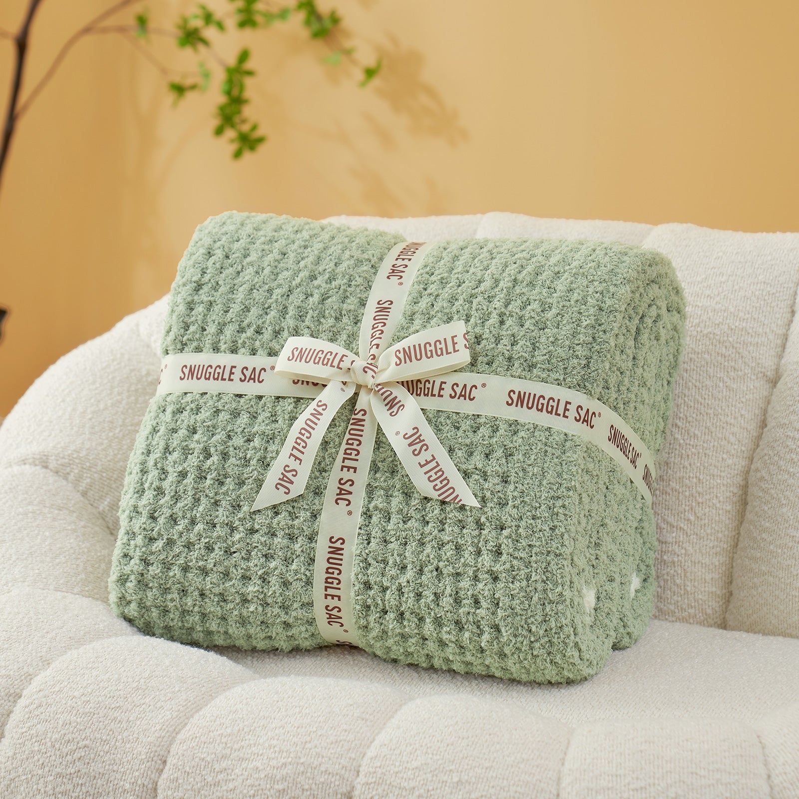 Soft Waffle Feather Yarn Knit Throw Blanket wrapped as a perfect gift with ribbon#Color_Sage Green