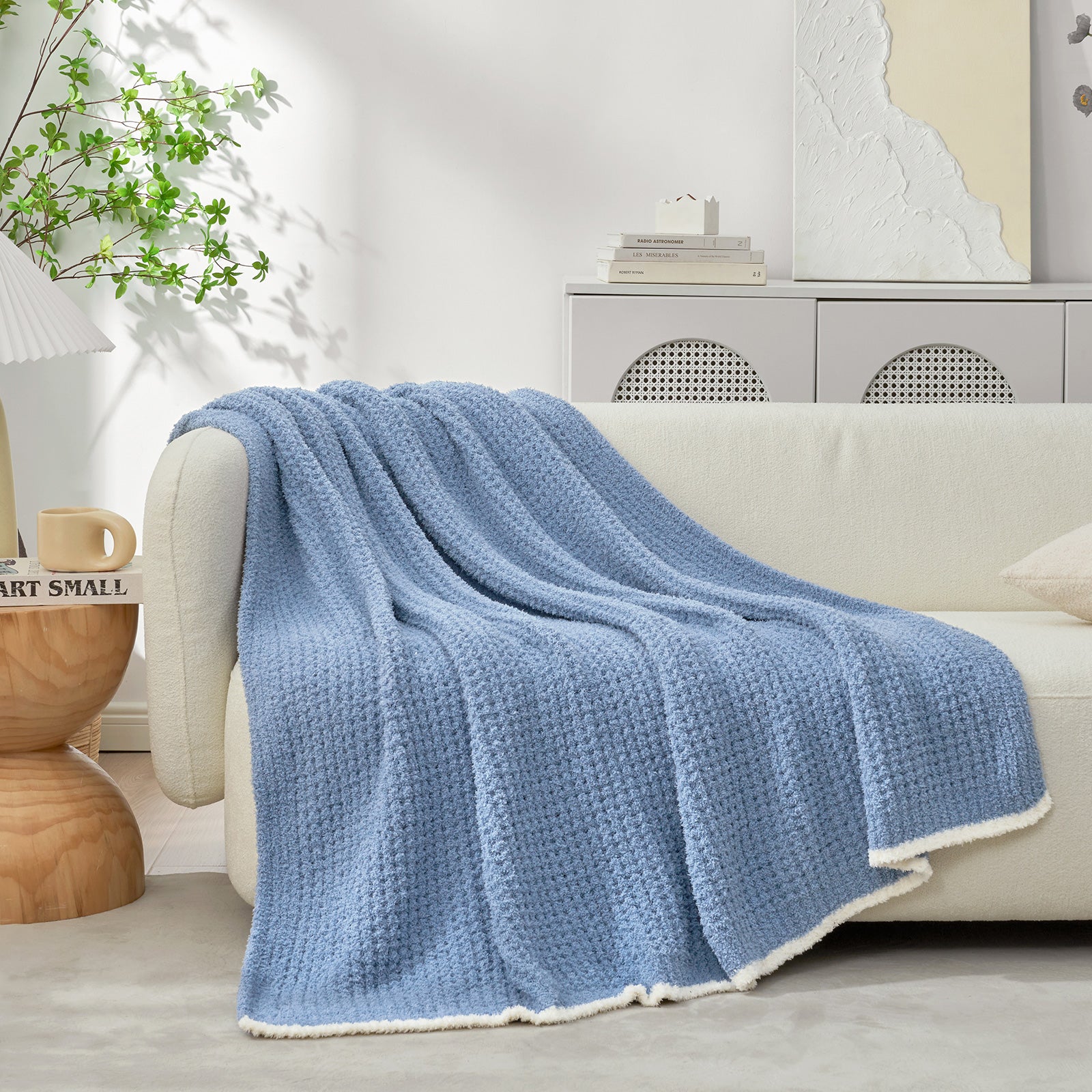  Soft Waffle Feather Yarn Knit Throw Blanket on a beige chair with vase of plant and mug#Color_Blue