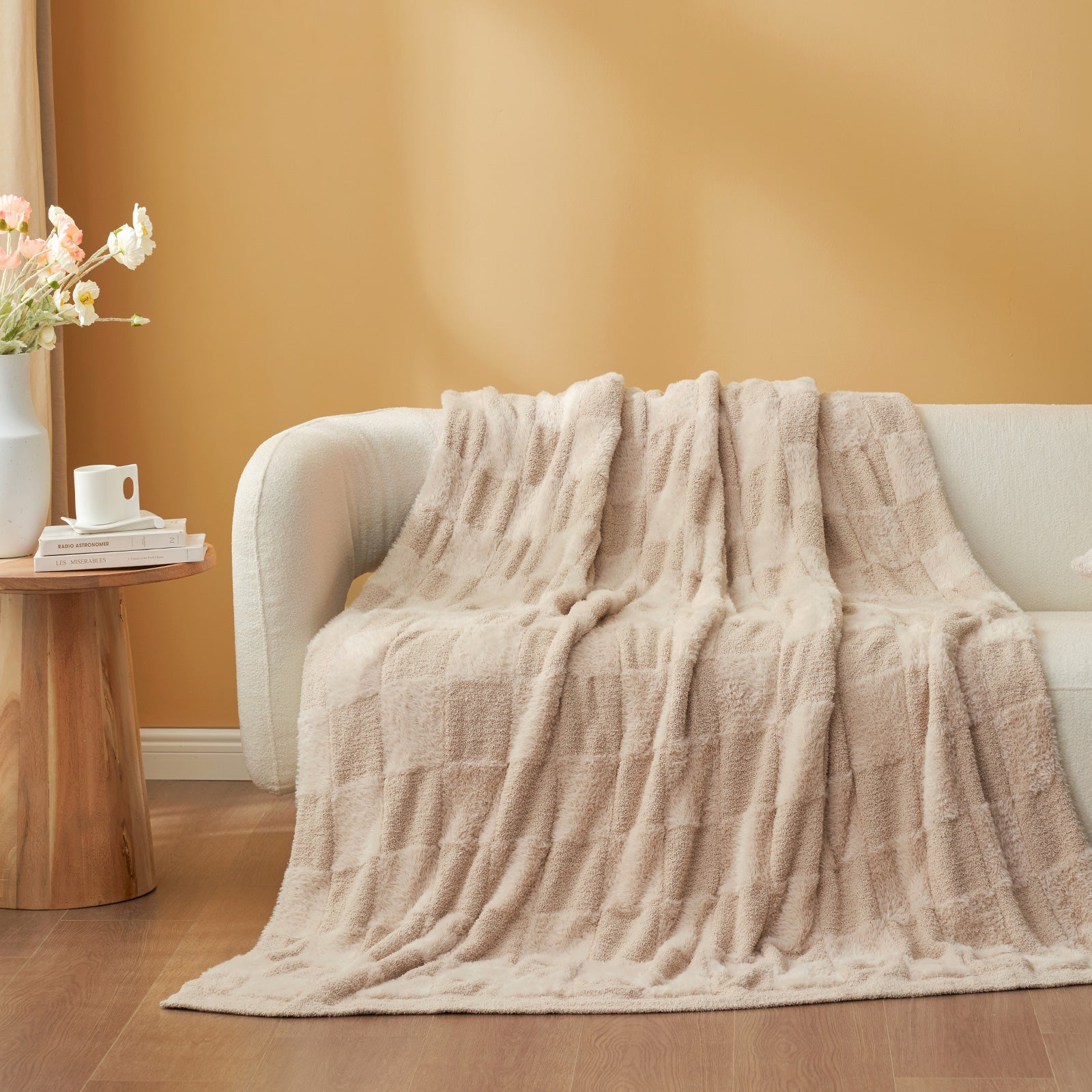 UltraCozy Solid Checkered Feather Yarn Knit Throw Blanket on a beige couch - #Color_Solid Beige