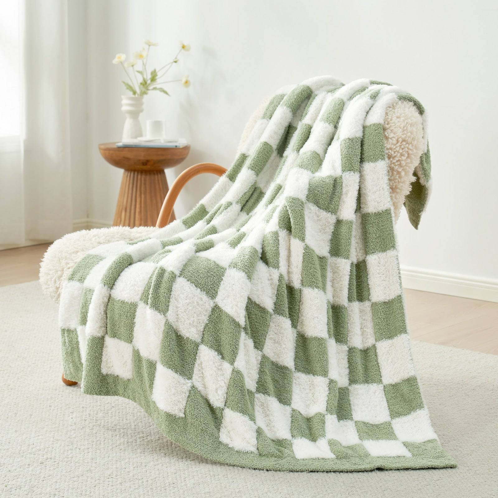 UltraCozy Checkered Feather Yarn Knit Throw Blanket on a beige chair #Color_Sage Green White