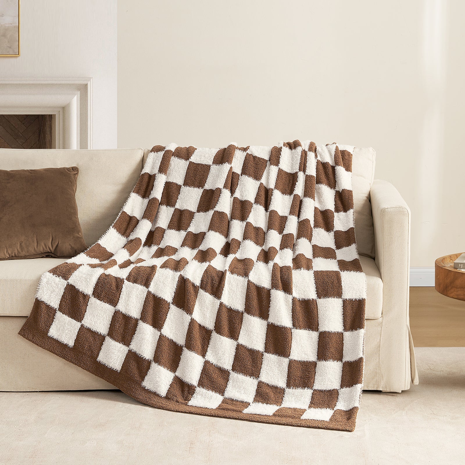 UltraCozy Checkered Feather Yarn Knit Throw Blanket on a beige couch #Color_Brown