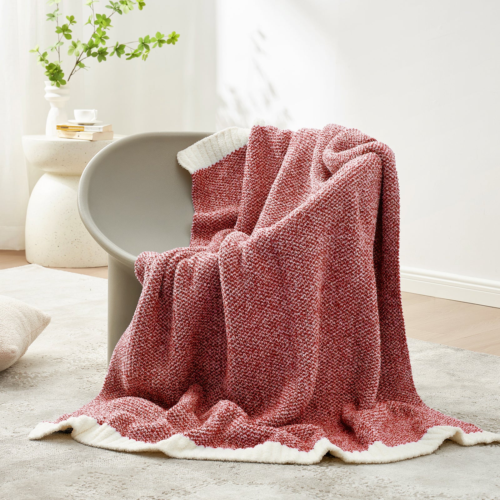Snuggle Sac Heather Feather Yarn Heather red Knit Throw Blanket  on the chair#color_Heather Red