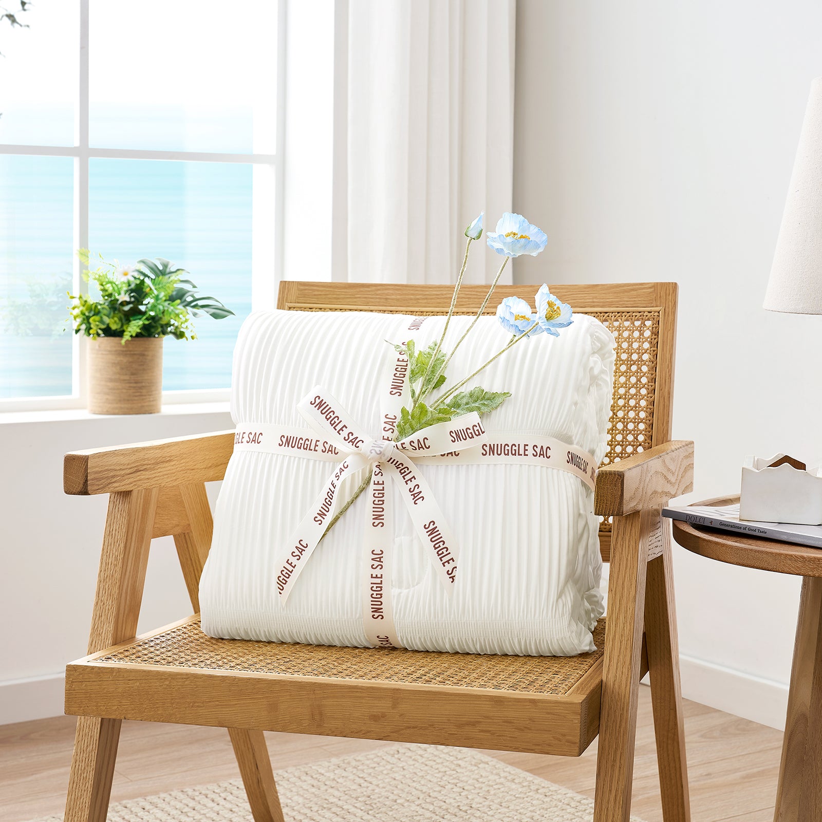 Folded Snuggle Sac white comforter with white ribbon,perfect as gift.#color_White