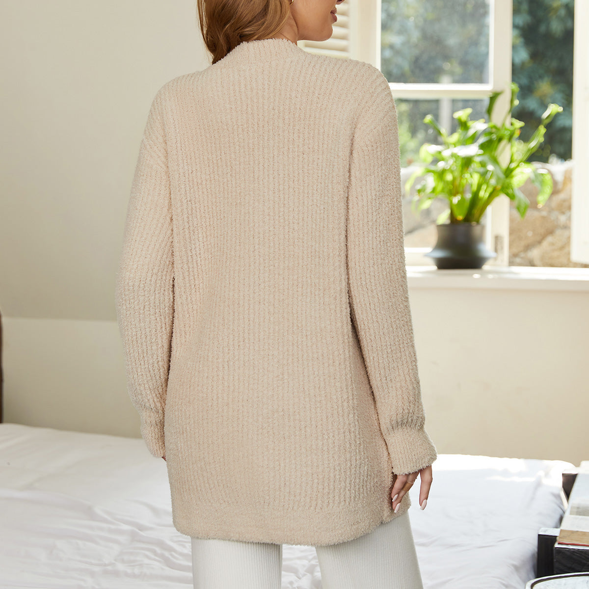Back view of women cardigan sweater with pocket in Beige, showcasing relaxed fit and soft knit texture #color_Beige