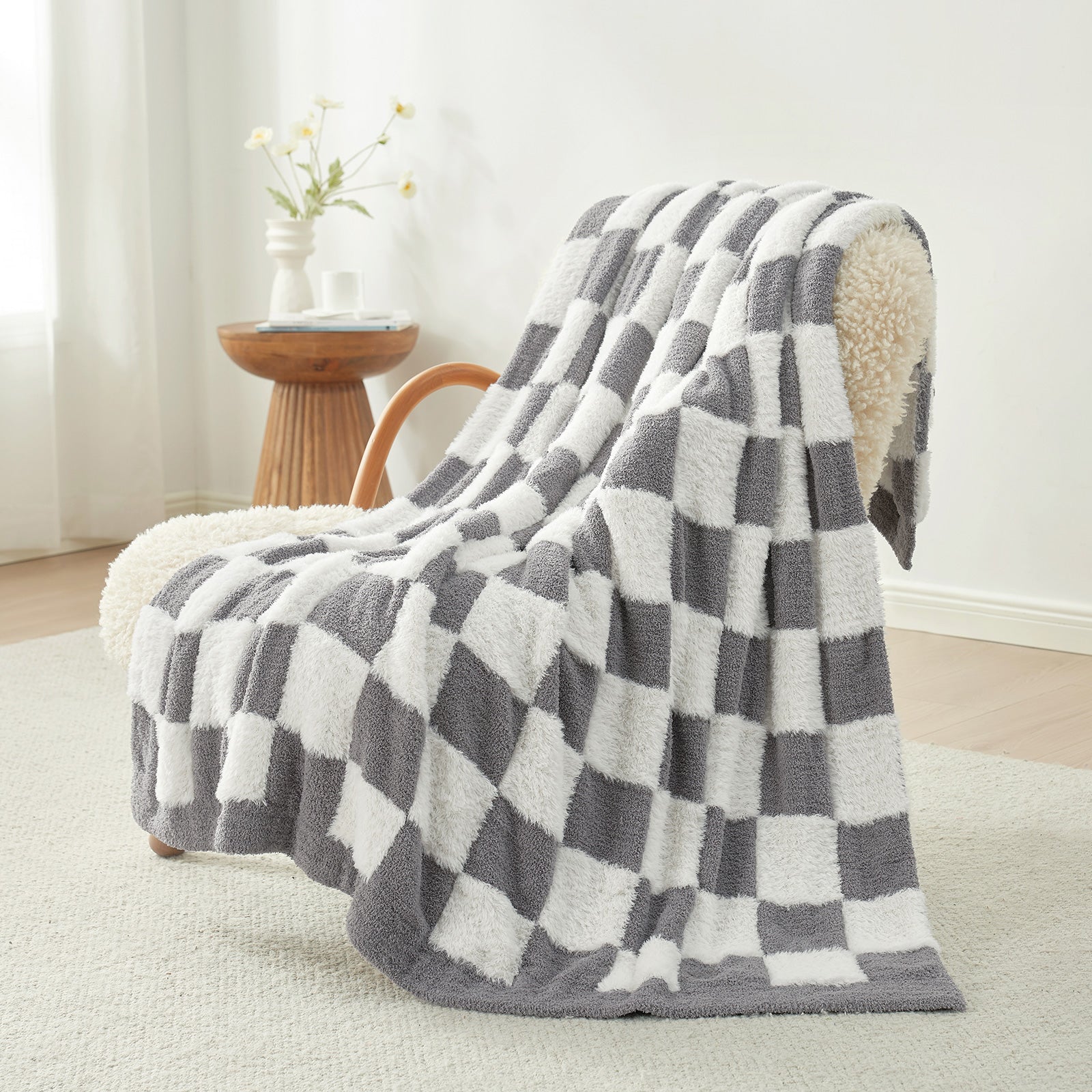 UltraCozy Checkered Feather Yarn Knit Throw Blanket on a beige chair#Color_Grey White