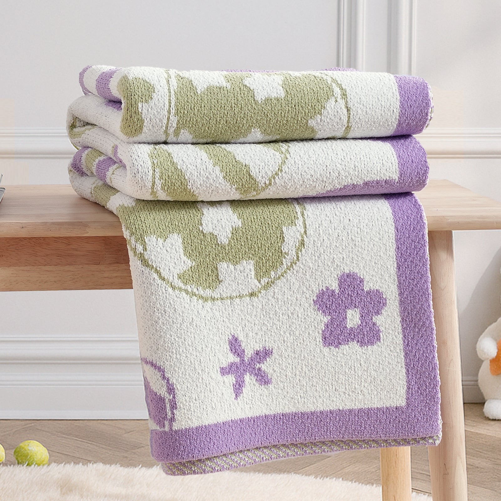 Stacked Easter bunny chenille knit throw blankets in purple showcasing thickness and texture #color_Purple
