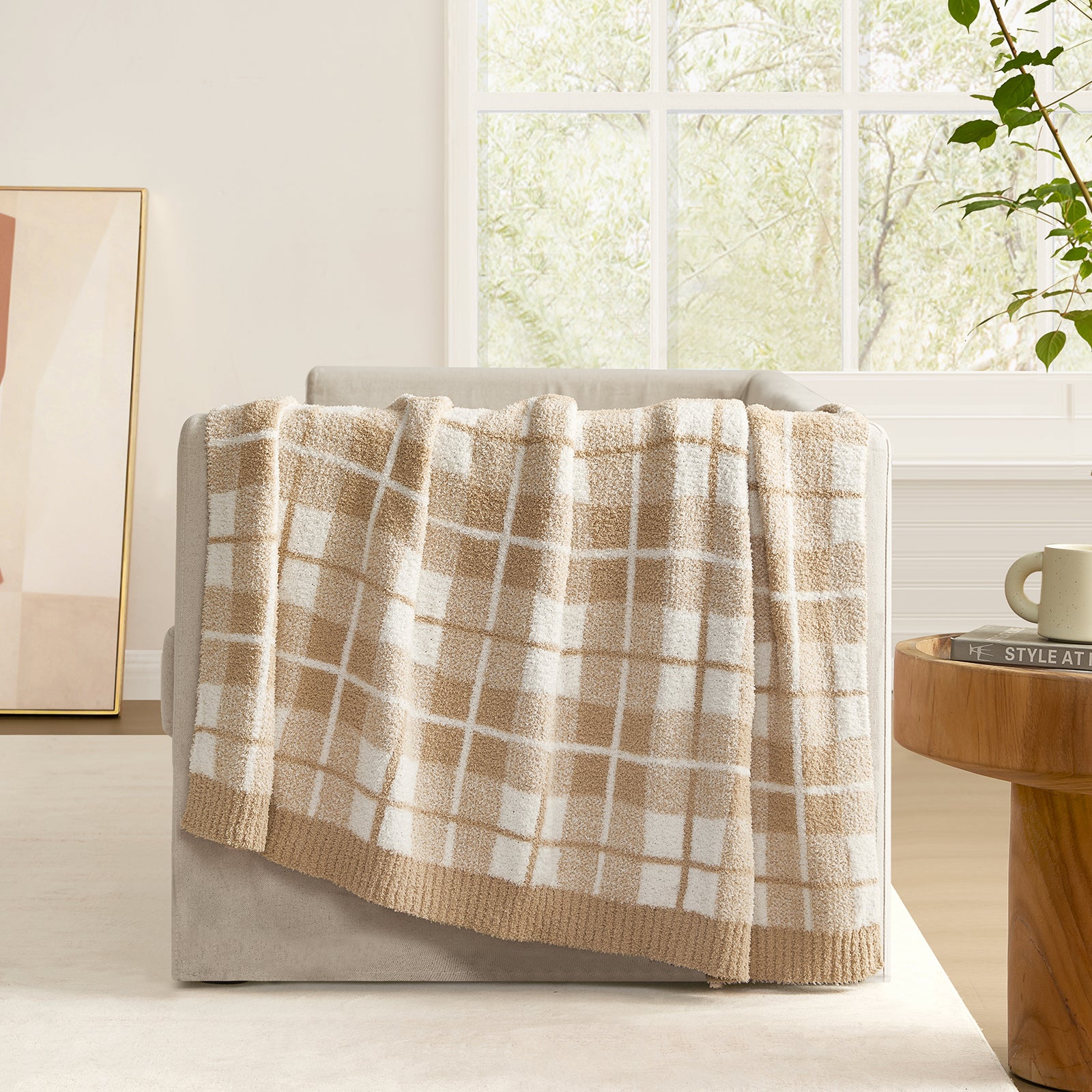 Reversible Buffalo Plaid Feather Yarn Knit Throw Blanket draped over a beige sofa with window and mirror #Color_Plaid Beige