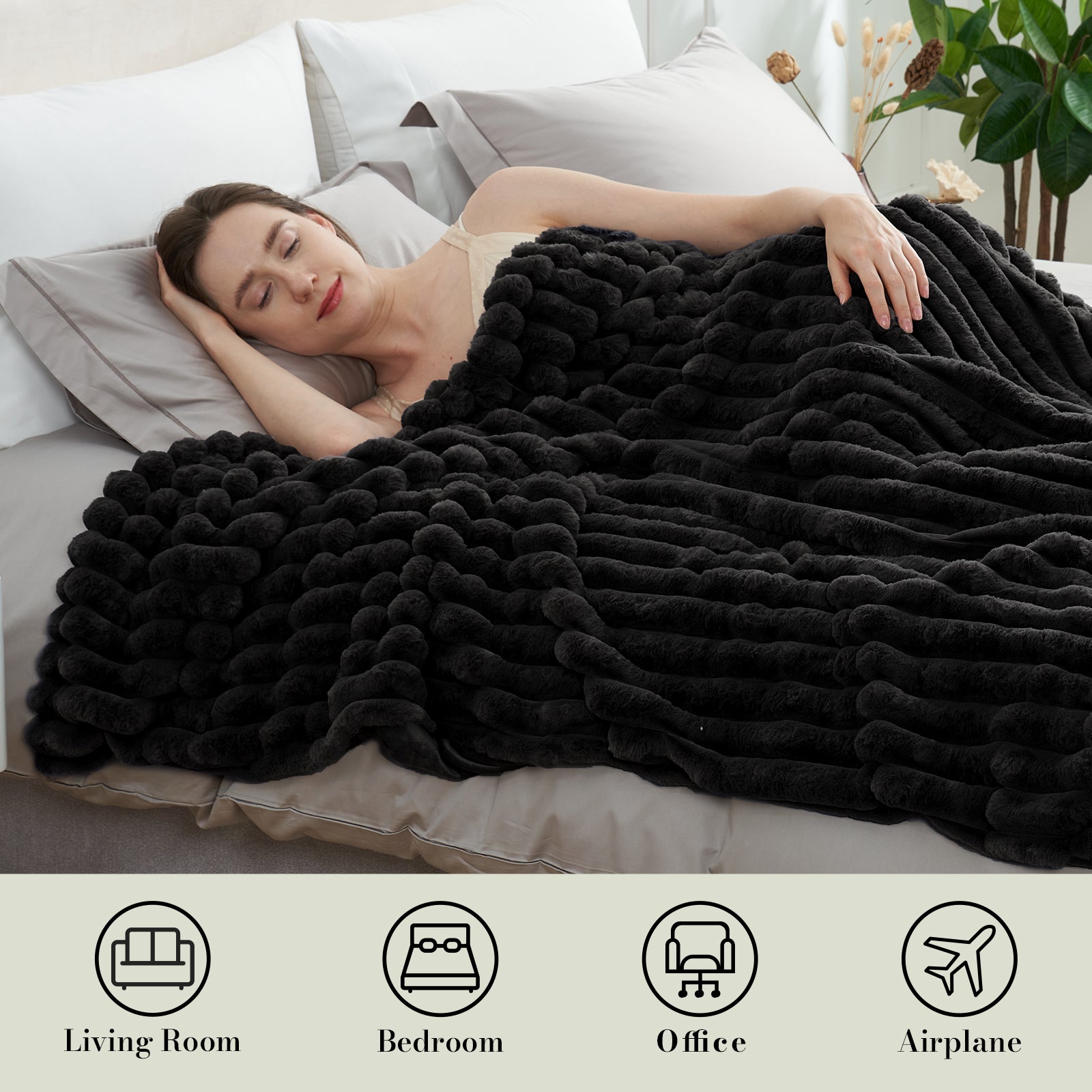 Woman sleeping under a striped faux fur throw blanket in Black for soft and comfortable warmth #color_Black