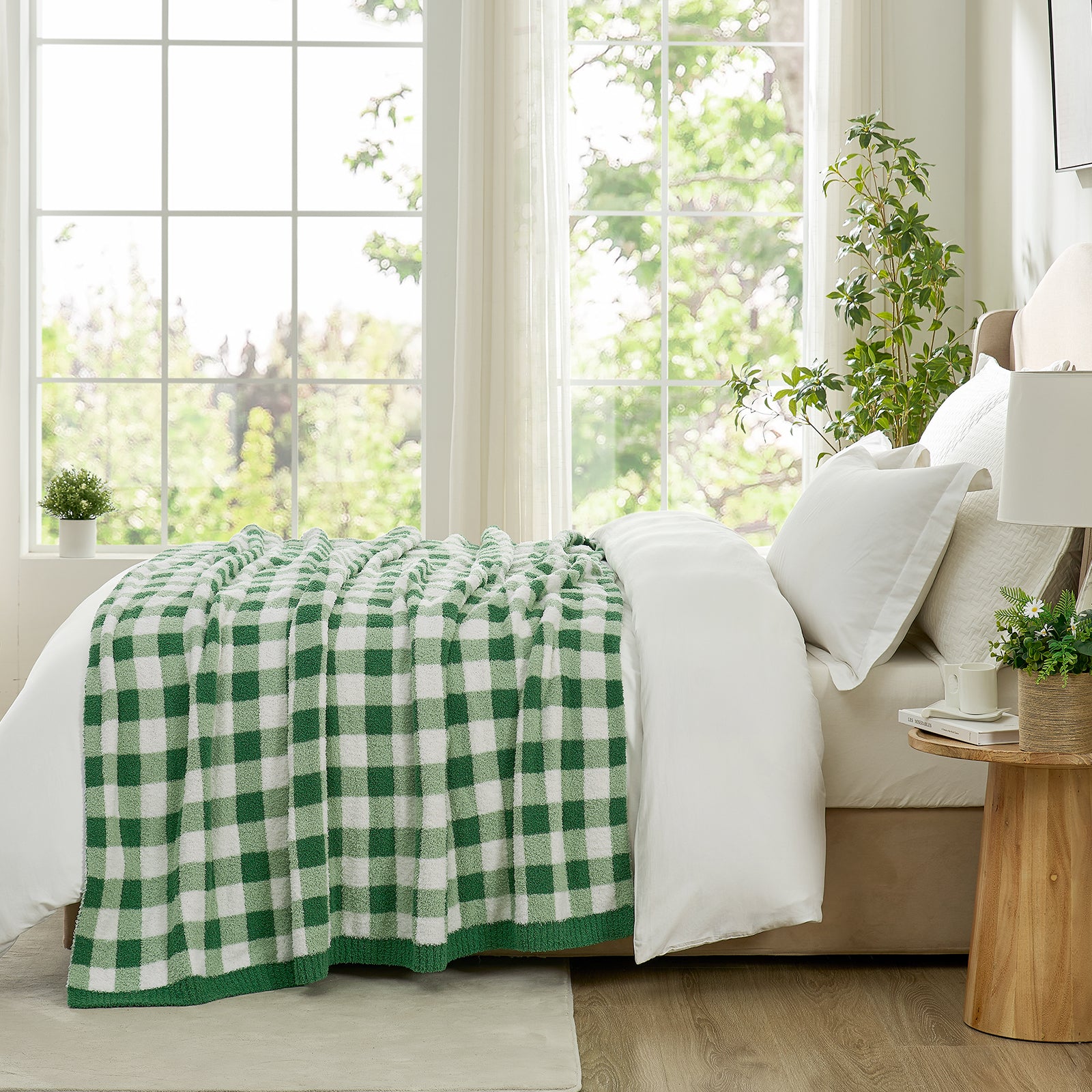  Side view of Green and white checkered blanket  in a bright room with a vase of Plants and window with view#color_Green
