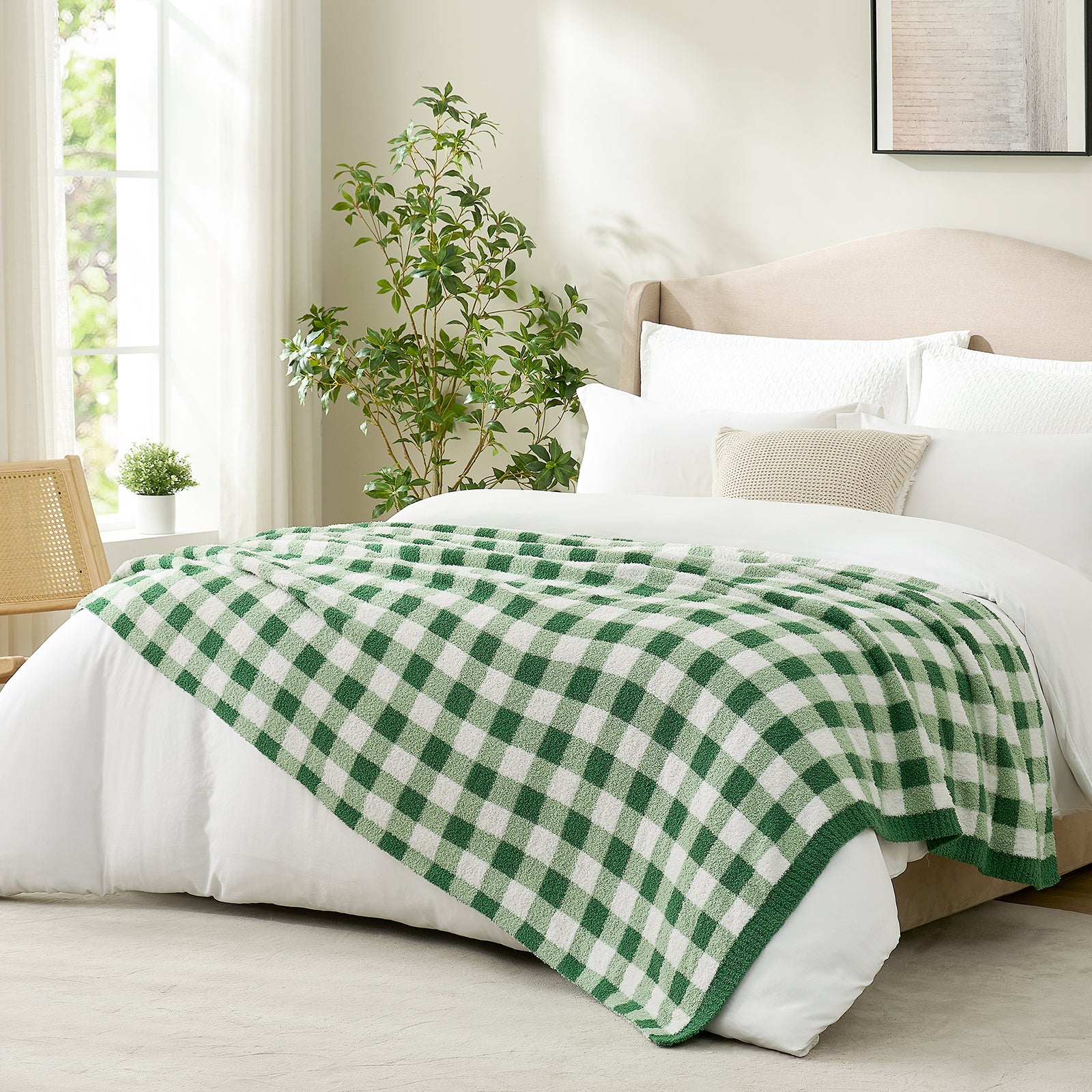 Side view of Green and white checkered blanket in a bright room with a vase of plants and window #color_Green