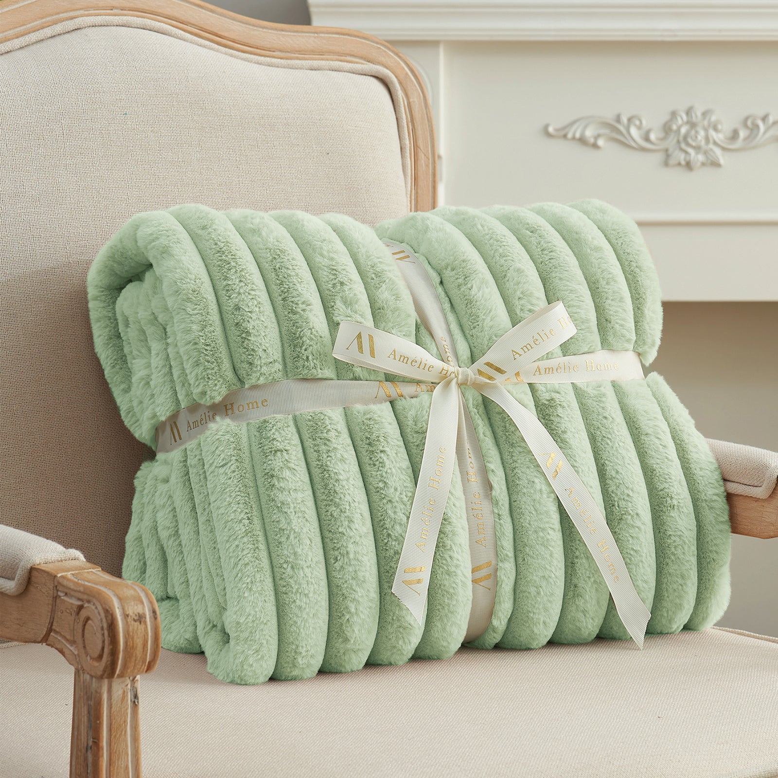 Striped faux fur throw blanket in Sage Green folded with ribbon, perfect for gifting #color_Sage Green