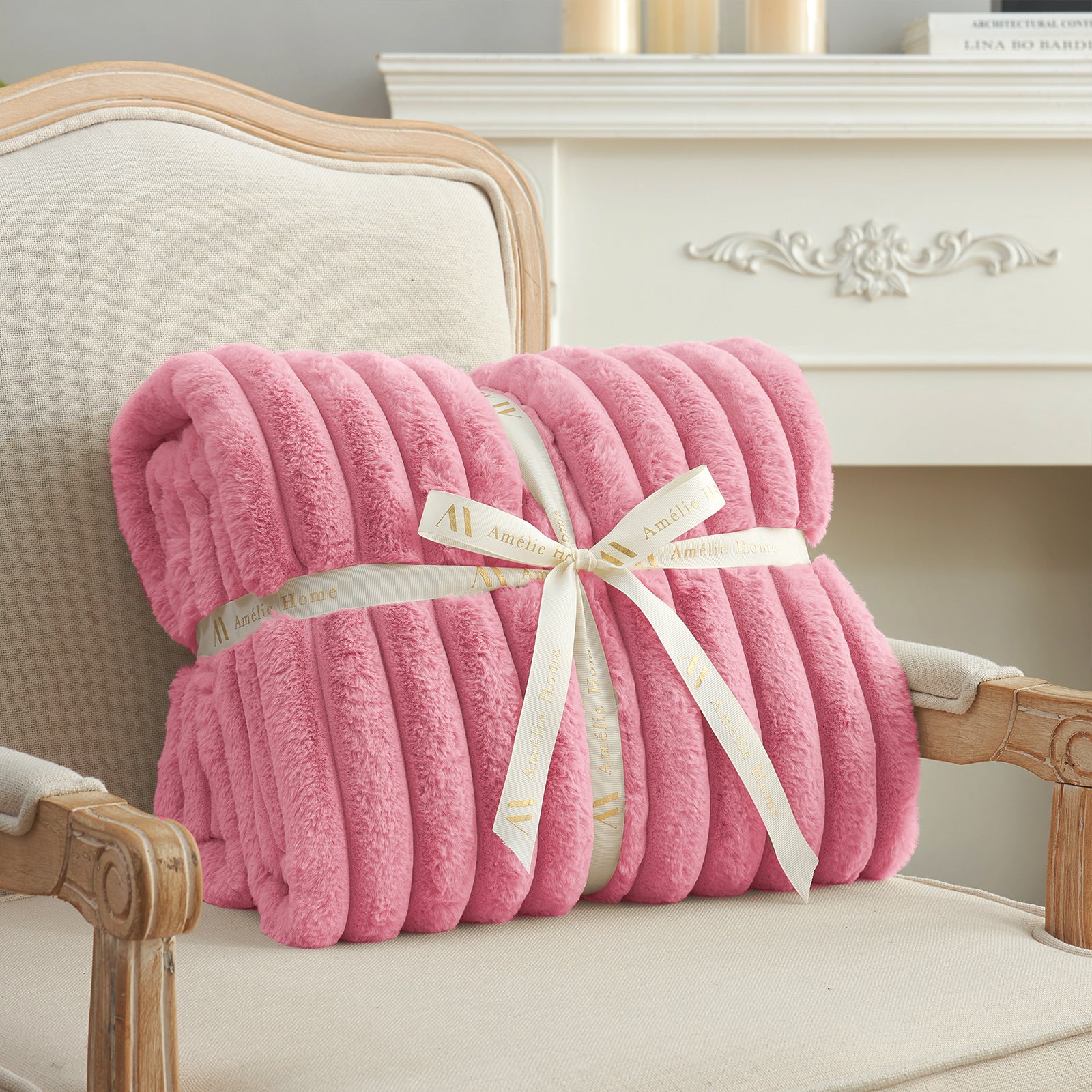 Striped faux fur throw blanket in Pink folded with ribbon, perfect for gifting #color_Pink