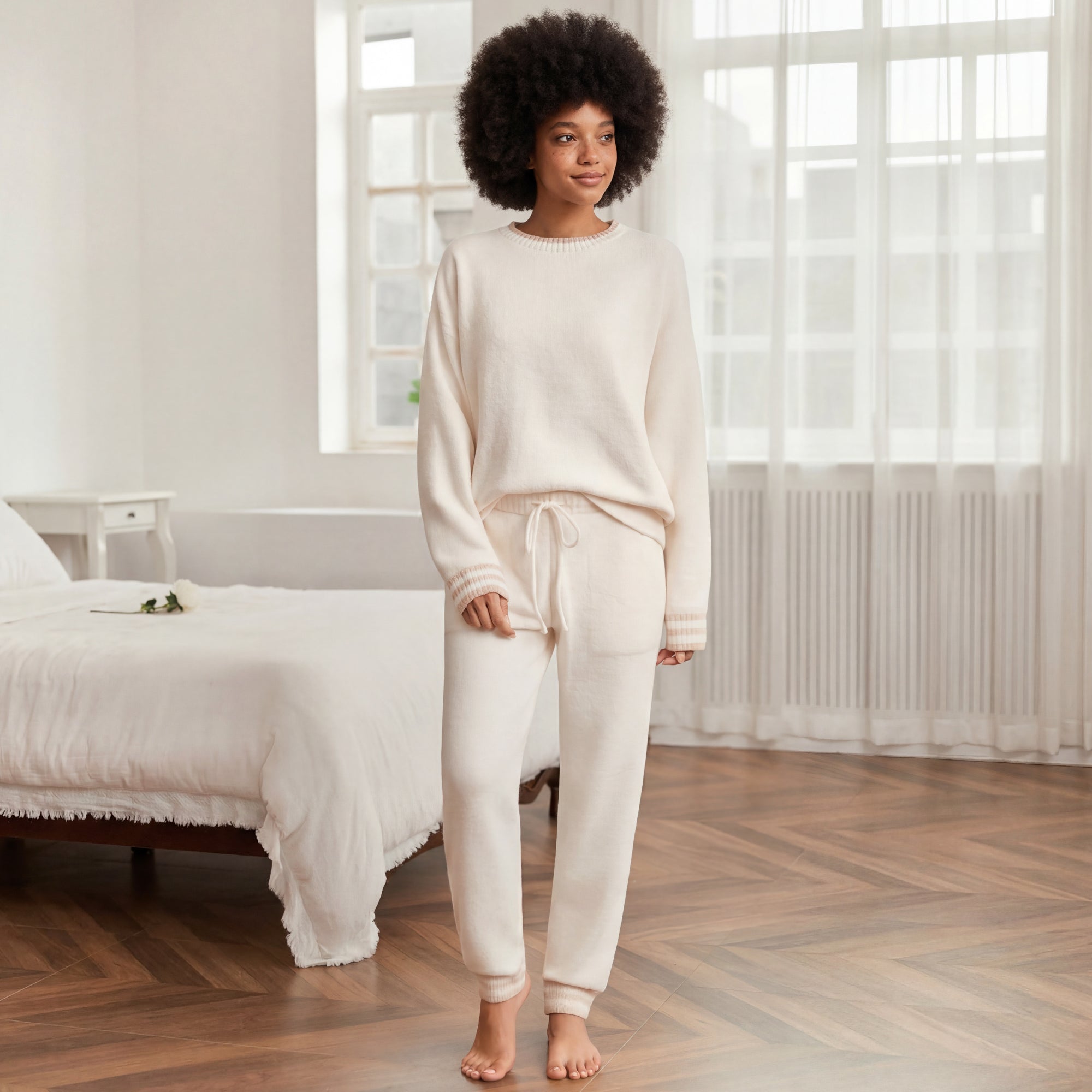 Snuggle Sac women long sleeve crewneck knit loungewear set in Ivory, styled in a cozy bedroom setting with a relaxed and comfortable fit #color_Ivory