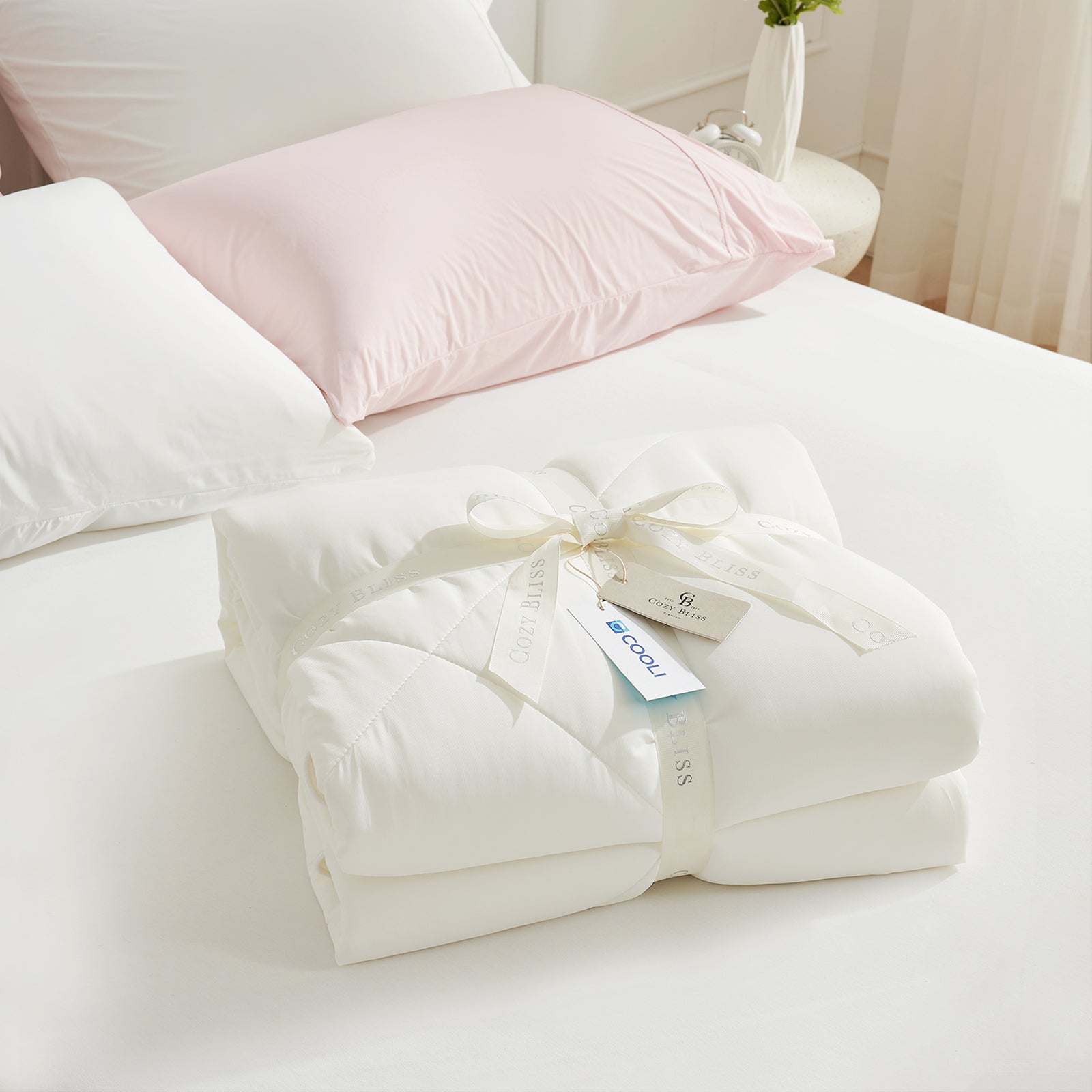 Folded Snuggle Sac cream white comforter with white ribbon,perfect as gift.#color_Cream White