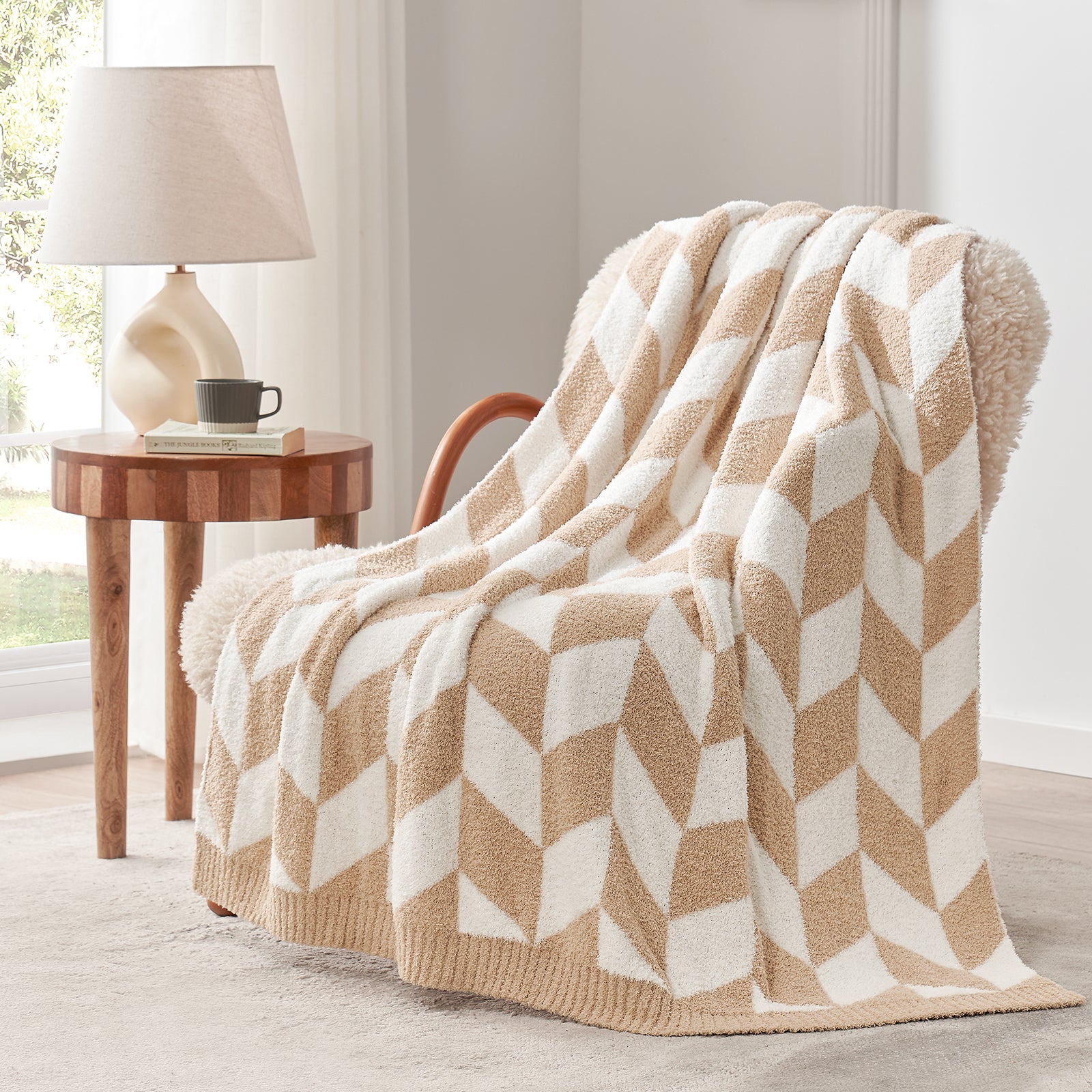 Snuggle Sacs Chevron Feather Yarn Knit Throw Blanket on the chair with lamp and window behind#color_Beige