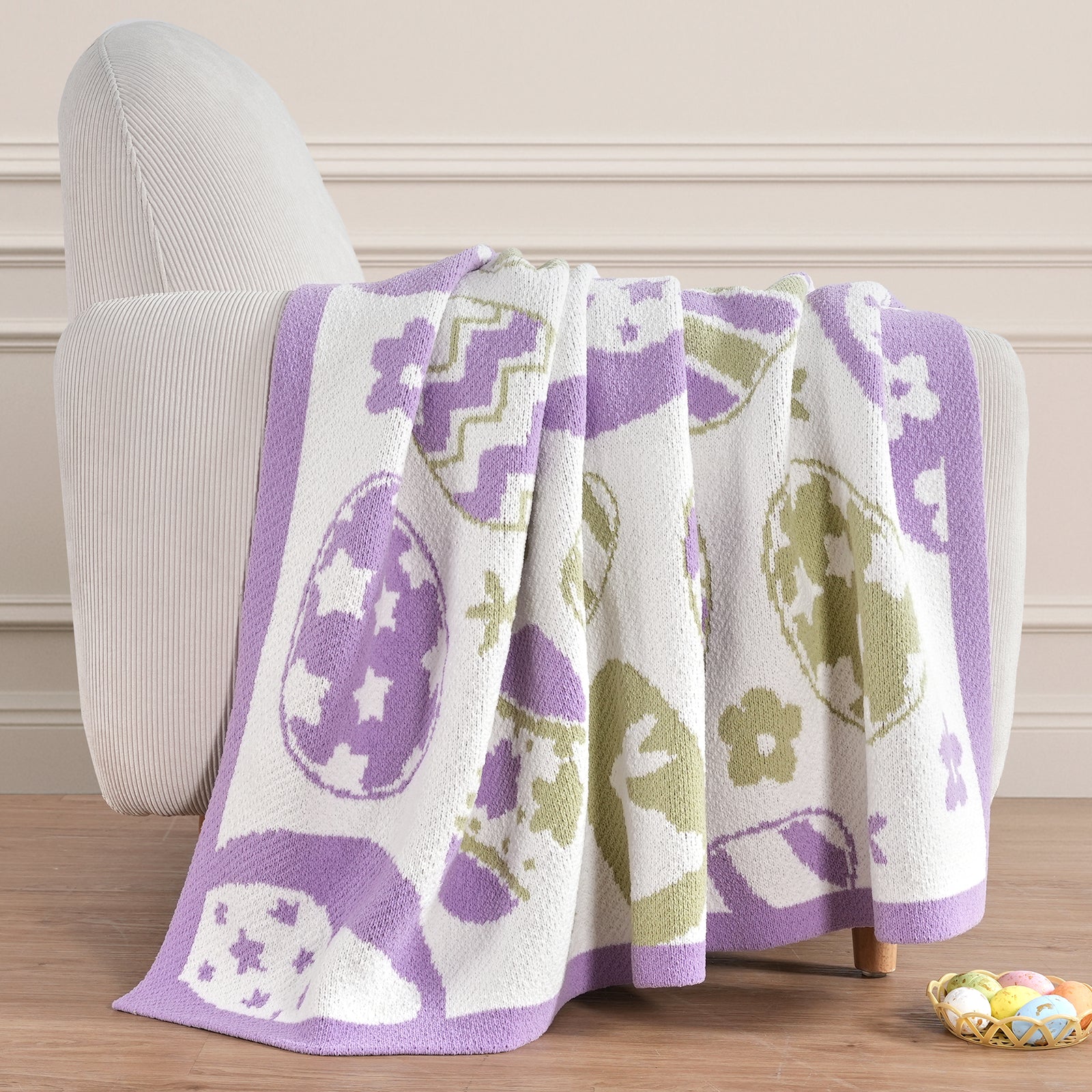 Festive bunny and egg patterned knit throw blanket in purple styled on a sofa for Easter decor #color_Purple