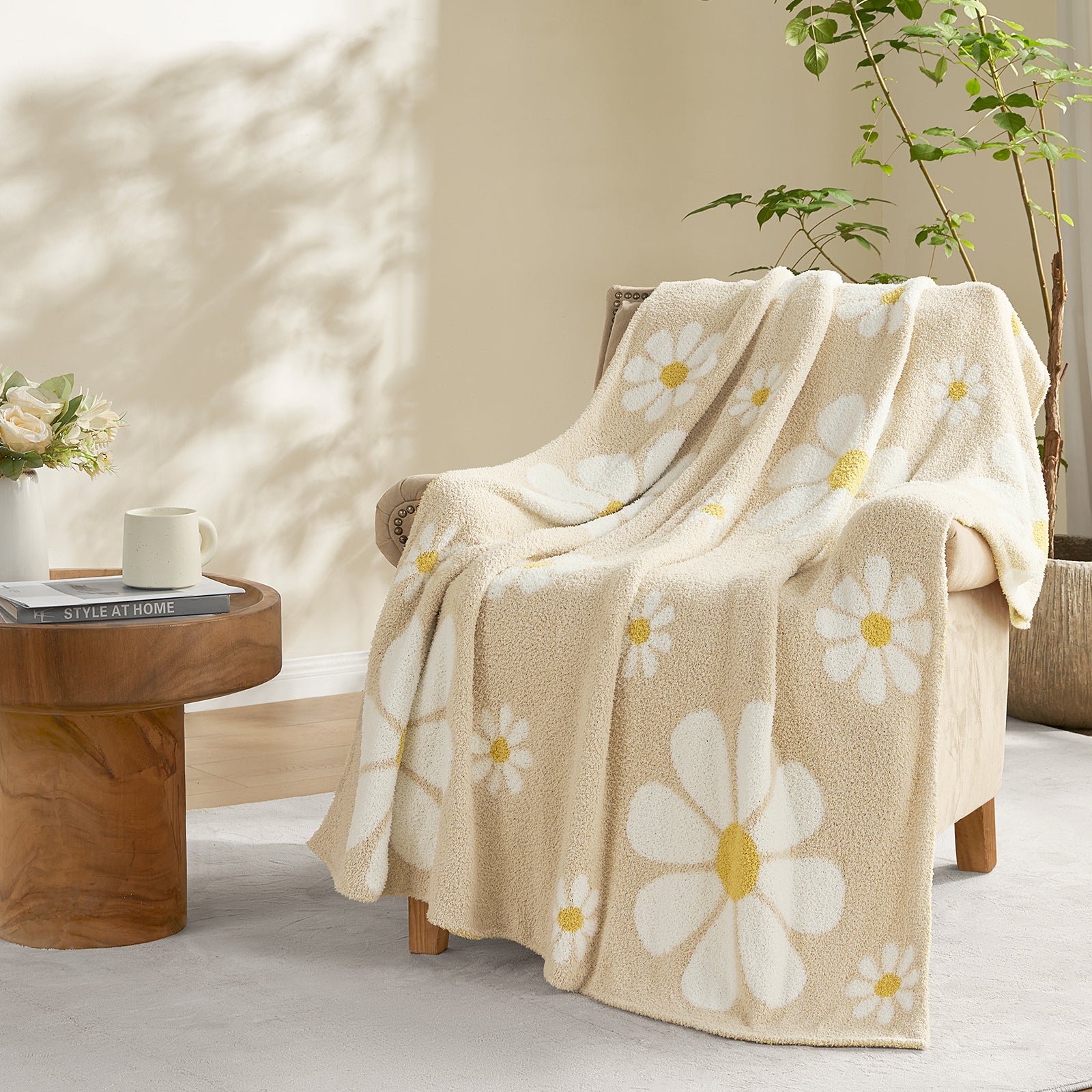 Snuggle Sacs Spring Floral Feather Yarn Knit Throw Blanket draped over a broen chair#Color_Beige