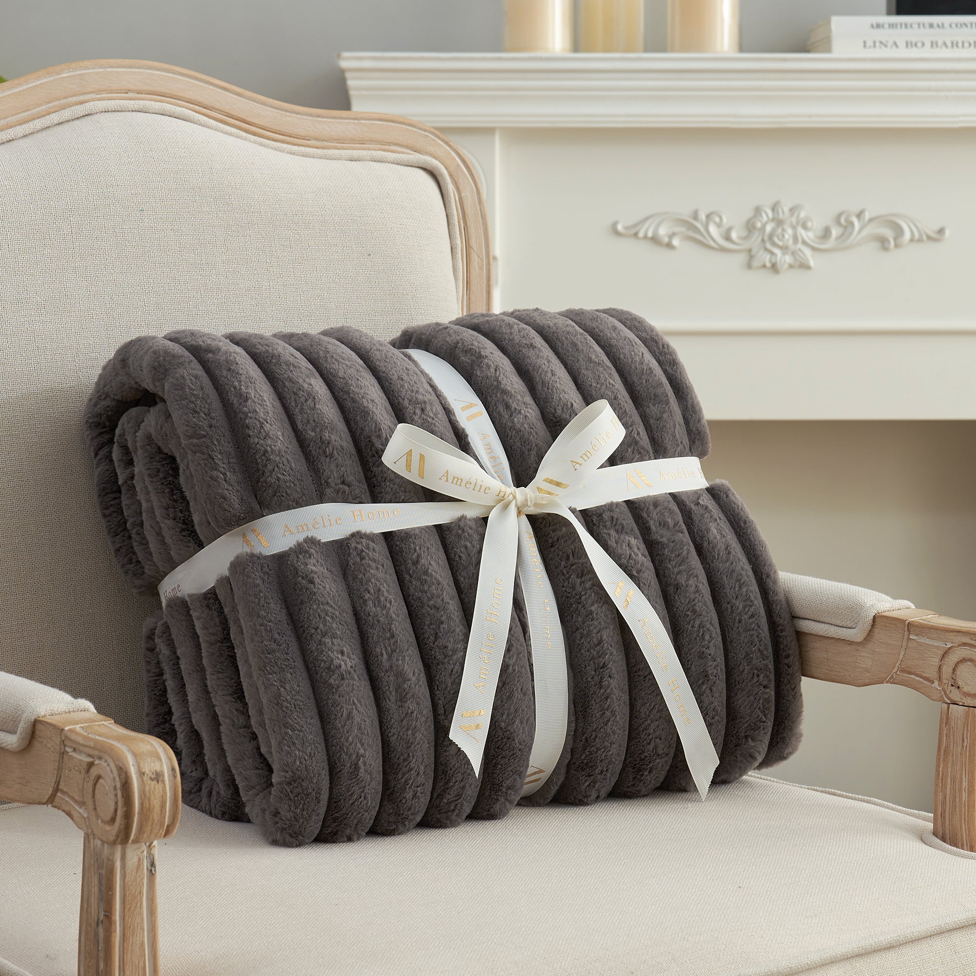 Striped faux fur throw blanket in Charcoal Grey folded with ribbon, perfect for gifting #color_Charcoal Grey