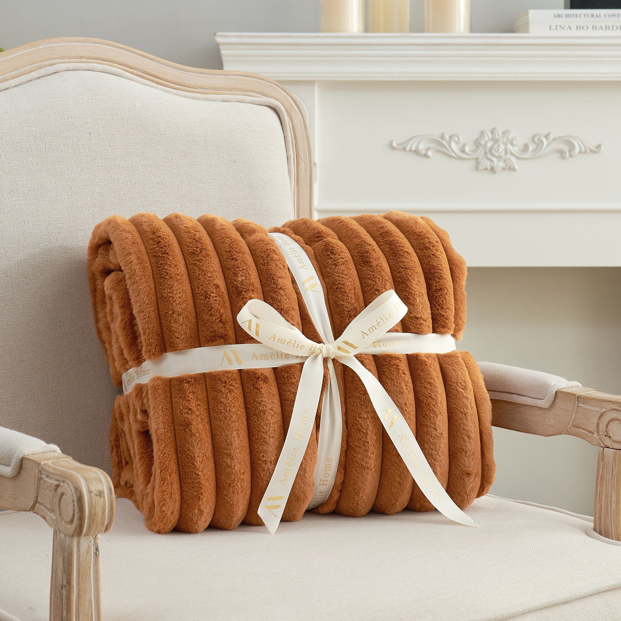 Striped faux fur throw blanket in Burnt Orange folded with ribbon, perfect for gifting #color_Burnt Orange