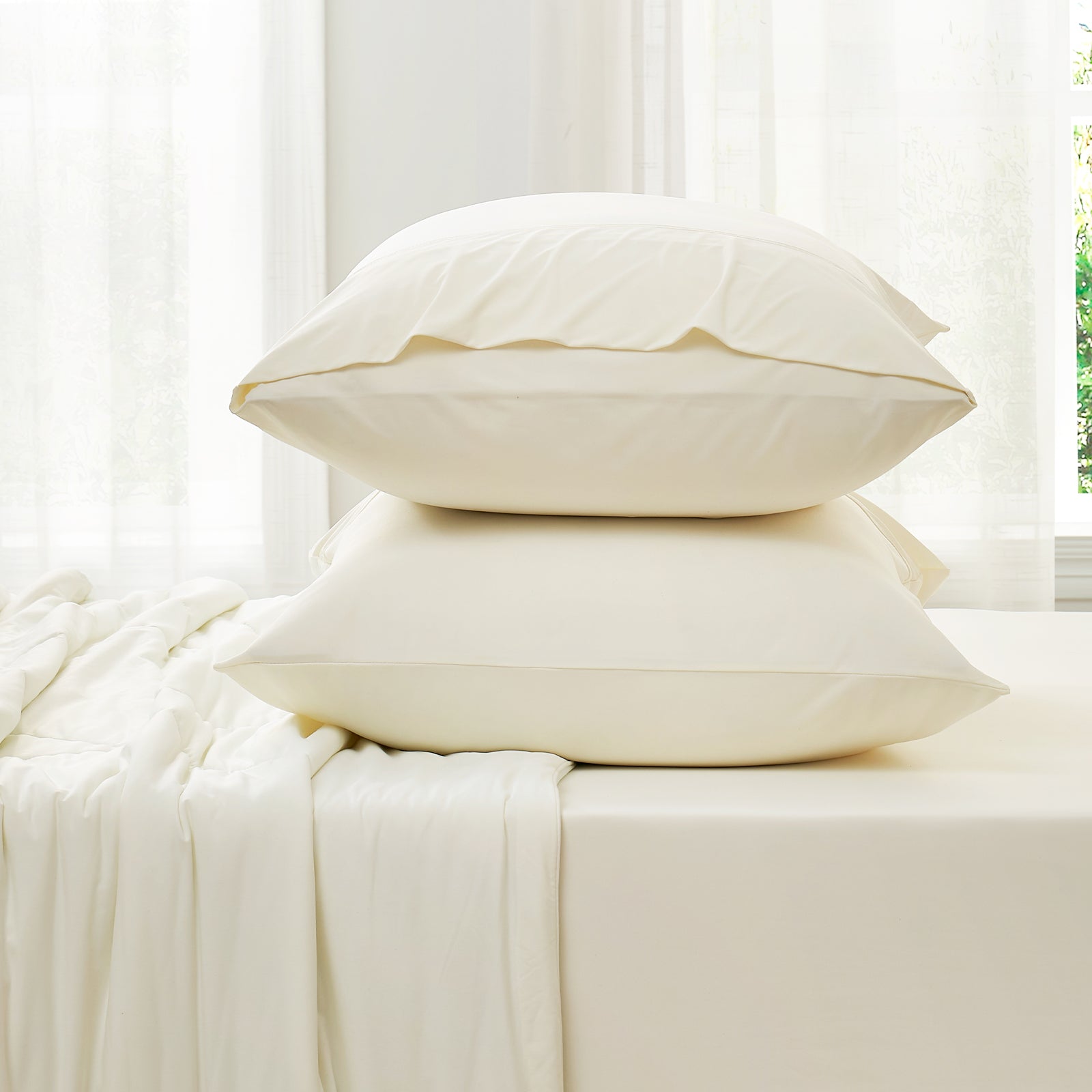 Side view of Snuggle Sac cooling fitted sheet and  pillowcase set#color_White