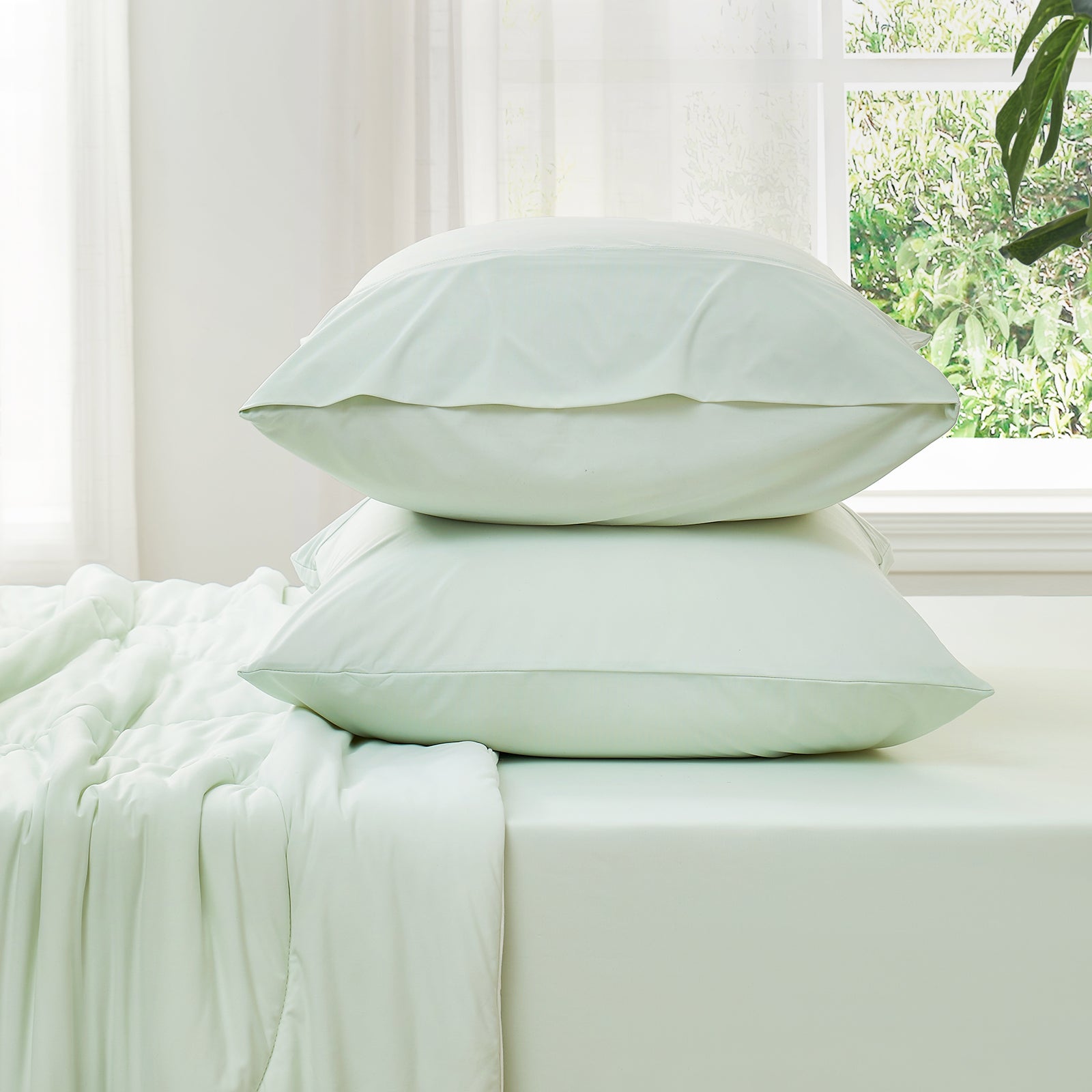 Side view of cooling fitted sheet and  pillowcase set#color_Mint Green