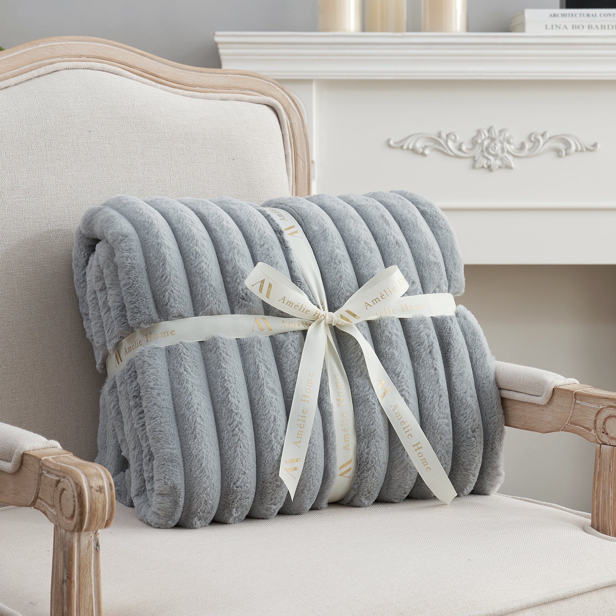 Striped faux fur throw blanket in Light Grey folded with ribbon, perfect for gifting #color_Light Grey