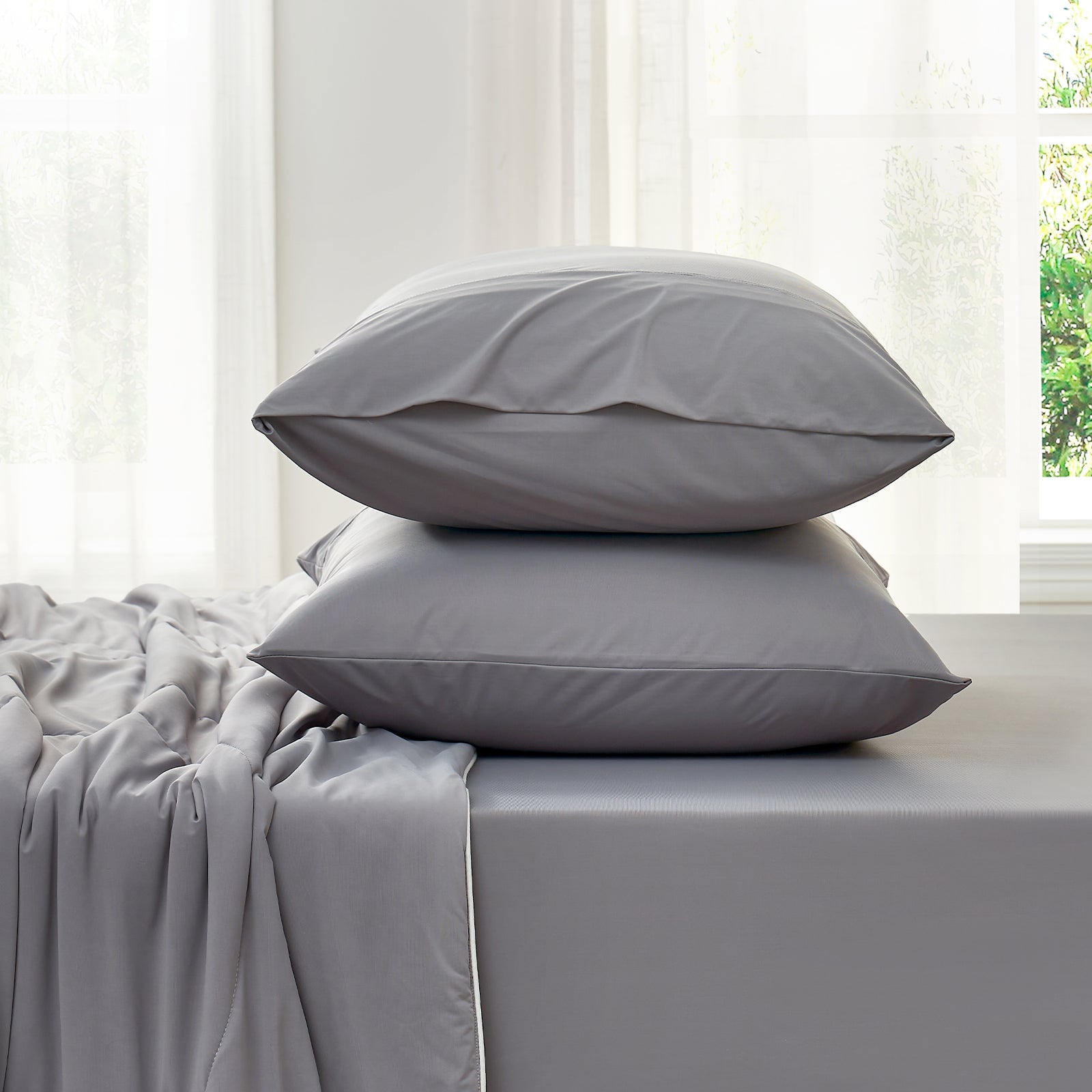 Side view of cooling fitted sheet and  pillowcase set#color_Dark Grey