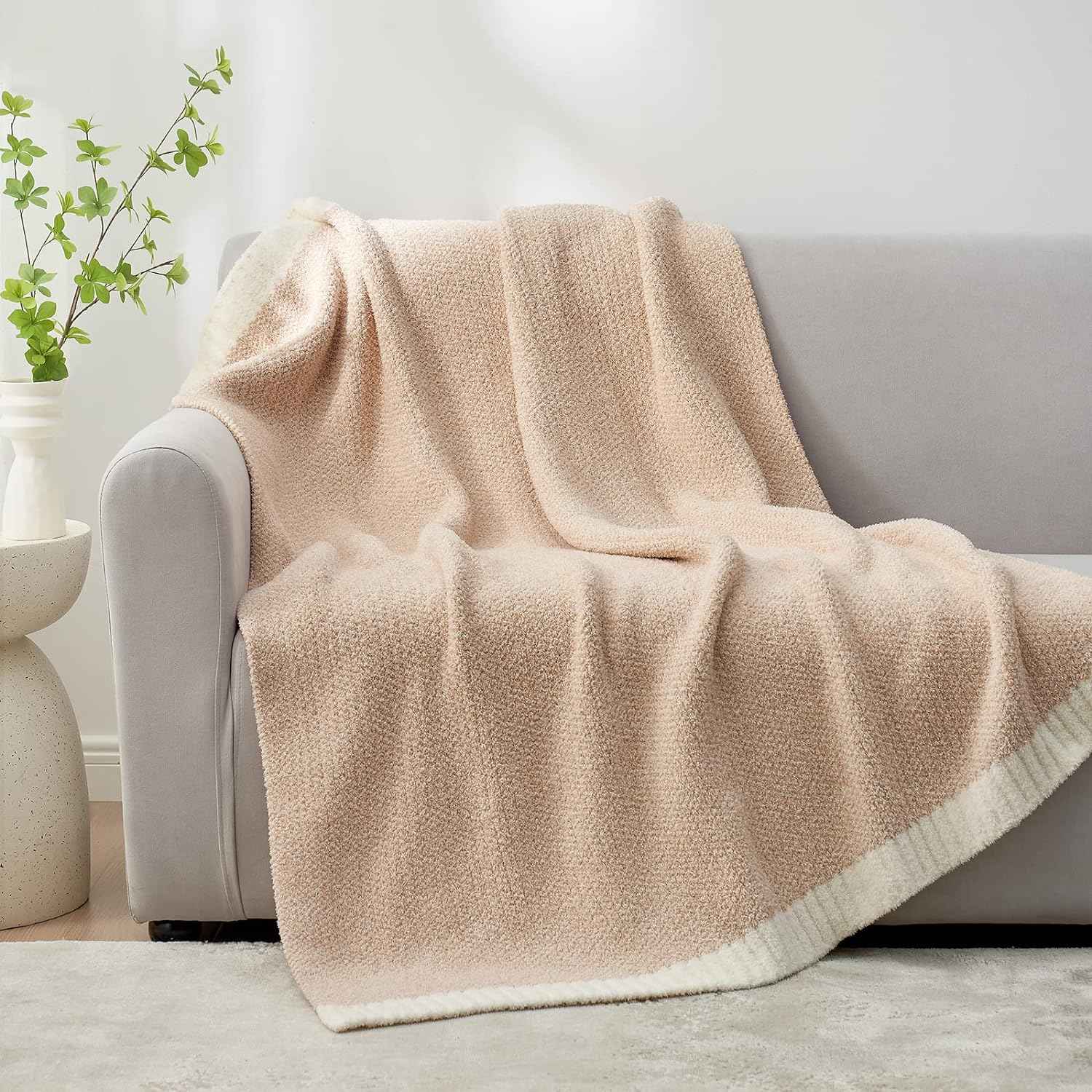 Snuggle Sac Heather Feather Yarn Knit Throw Blanket on the couch#color_Cream/Beige