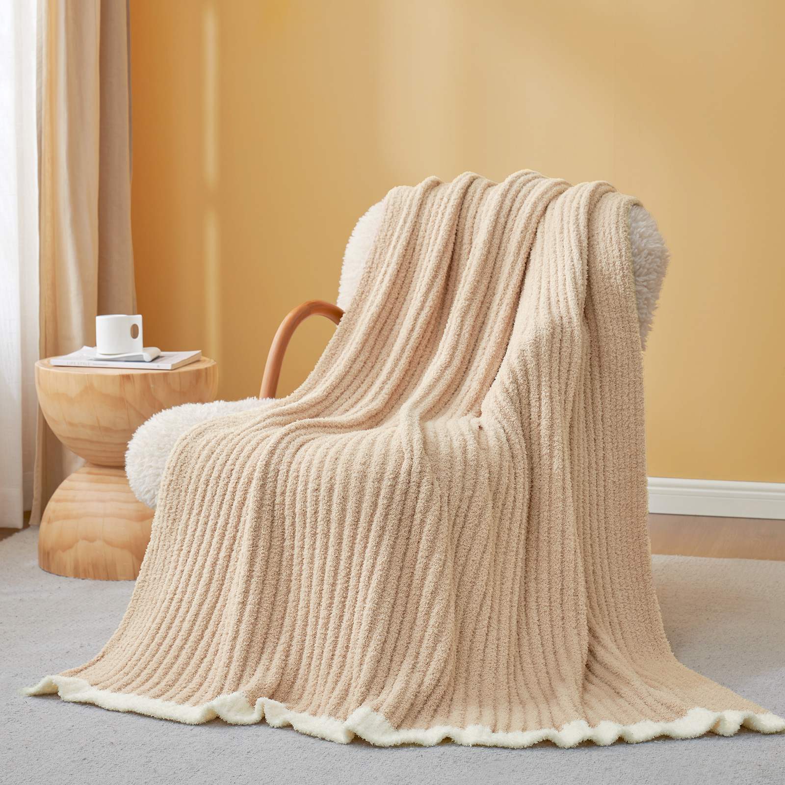 Snuggle Sac UltraSoft Ribbed Feather Yarn Knit Throw Blanket draped on the chair with a vase of flower#Color_Beige