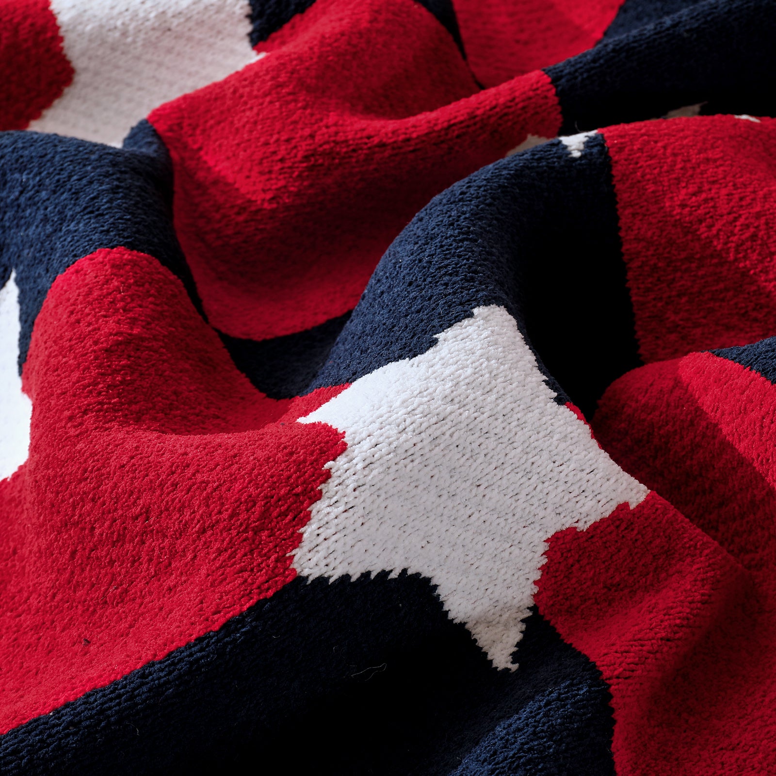 Close up of Independent Day chenille knit throw blanket in Red White highlighting soft texture and star pattern #color_Red White