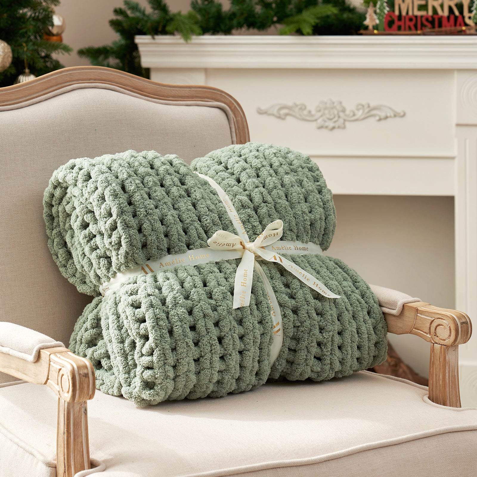 Rolled chunky knit throw blanket in Sage Green with ribbon showcasing plush texture #color_Sage Green