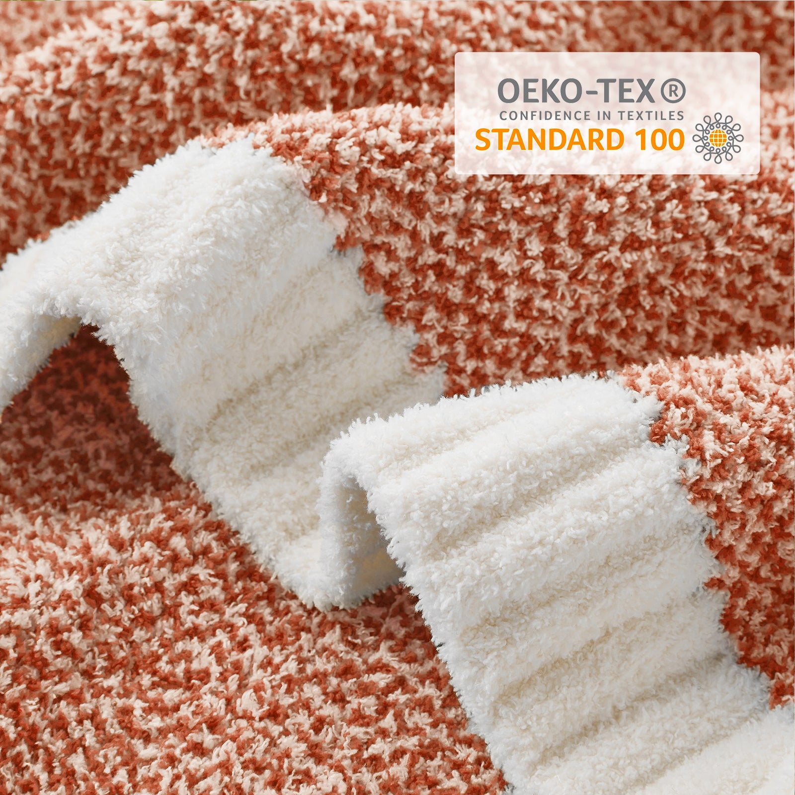 Close up of Snuggle Sac Heather Feather Yarn Knit Throw Blanket with OEKO-TEX Certificate#Color_Orange