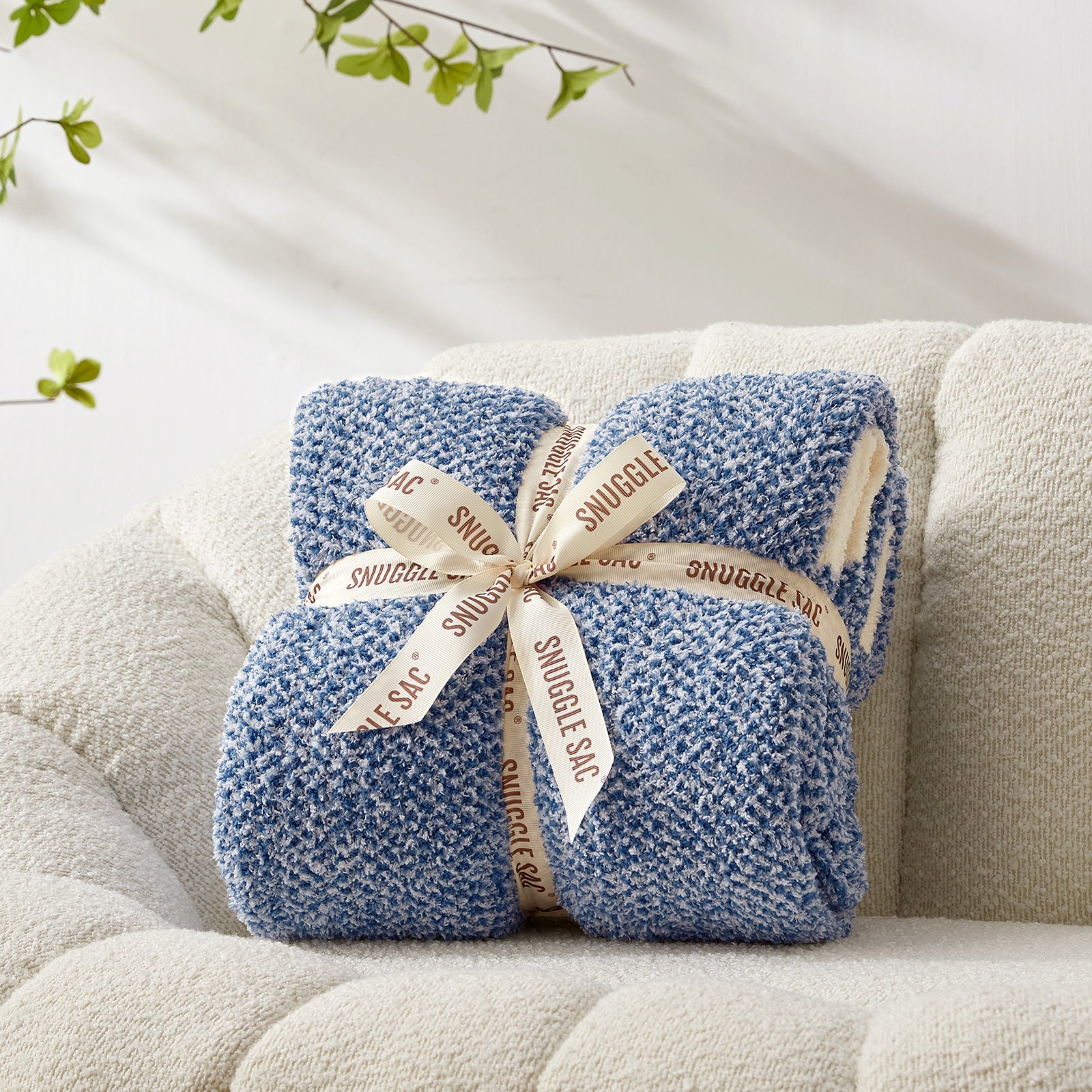 Snuggle Sac Heather Feather Yarn Royal Blue Knit Throw Blanket wrapped as a perfect gift for people#color_Heather Royal Blue