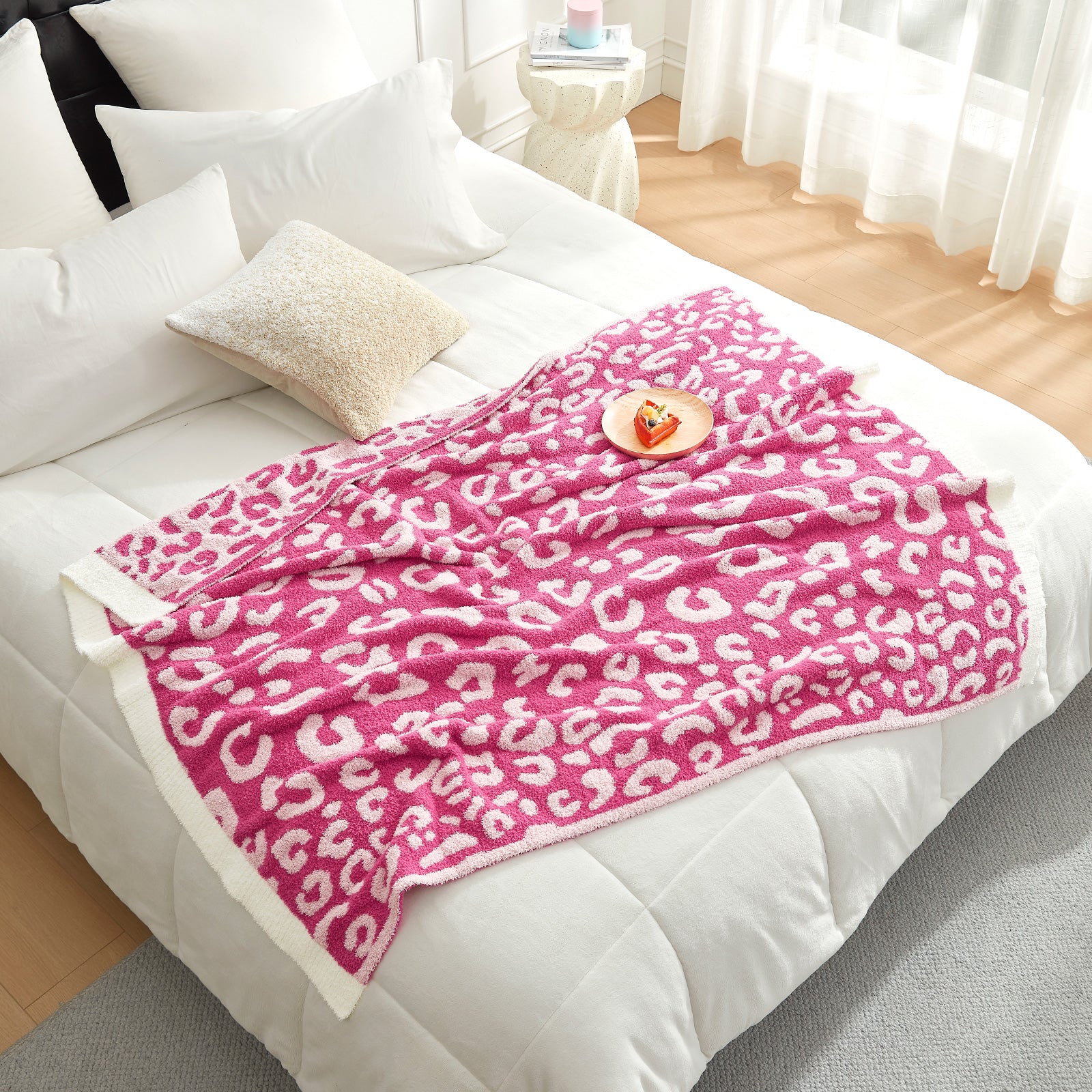 Reversible Leopard Feather Yarn Knit Throw Blanket on a bed with a plate with cake in a bright room#Color_Hot Pink