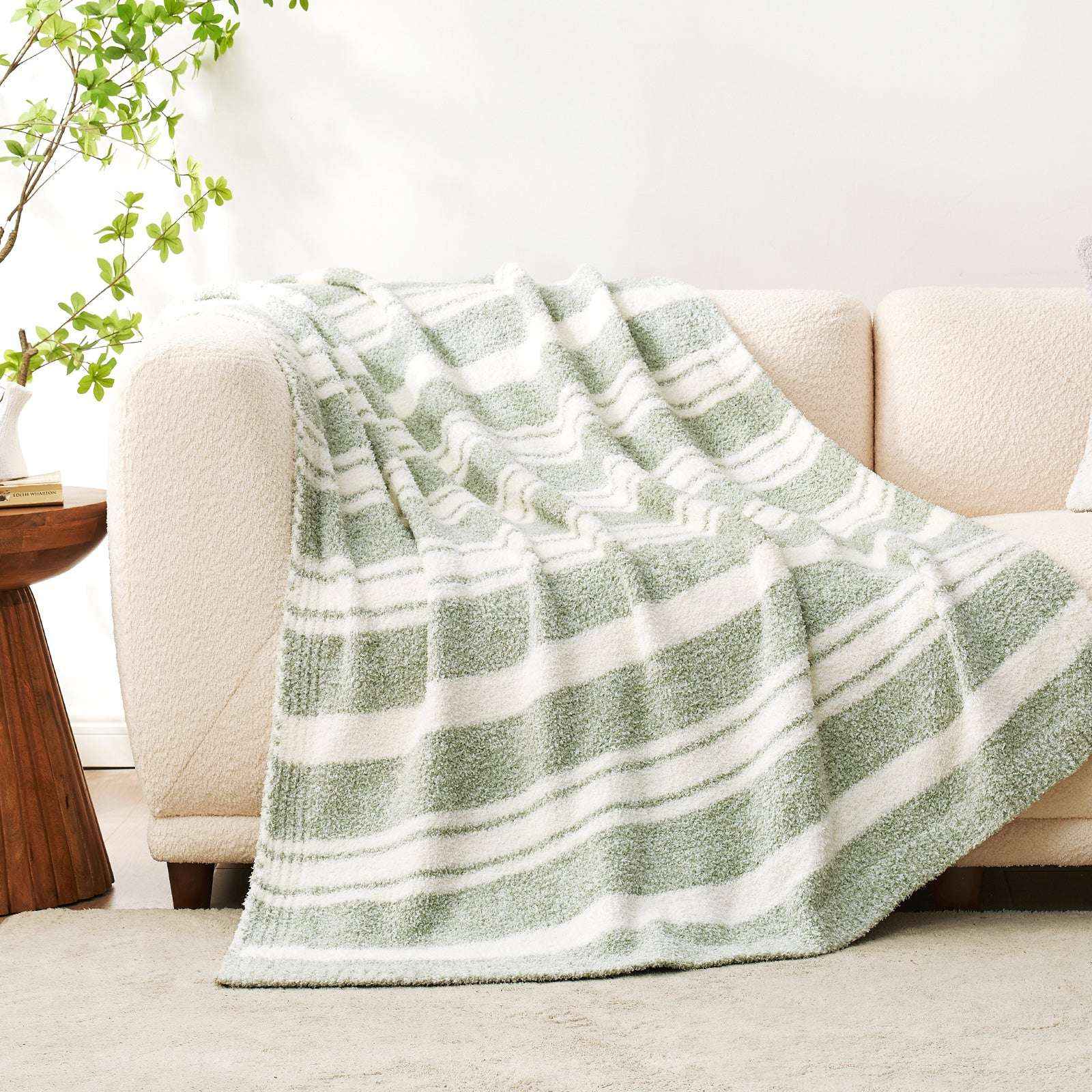 Striped Feather Yarn Knit Throw Blanket on a beige couchColor_Sage Green