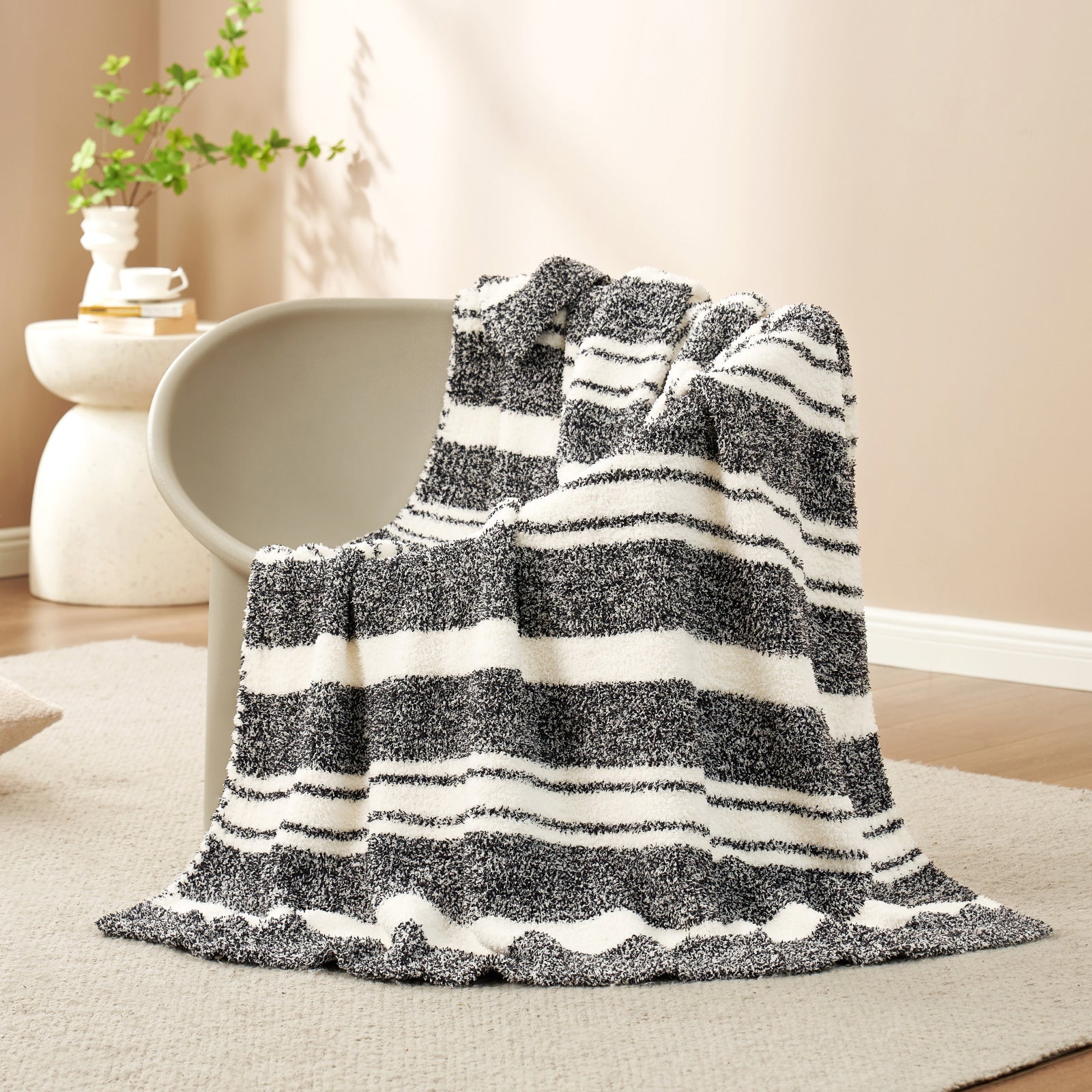 Striped Feather Yarn Knit Throw Blanket on a brown chair#Color_Black