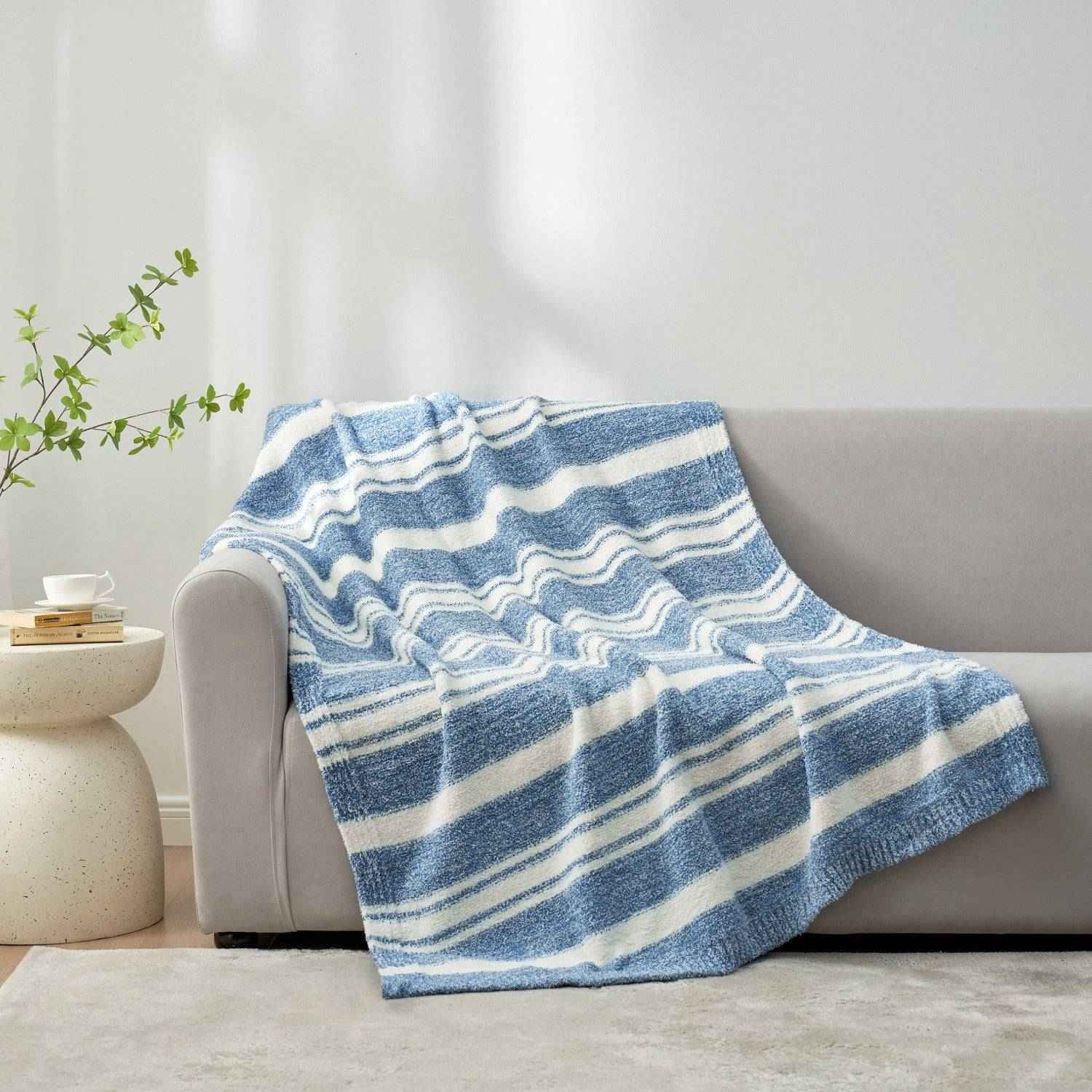 Striped Feather Yarn Knit Throw Blanket on a grey couch#Color_Blue